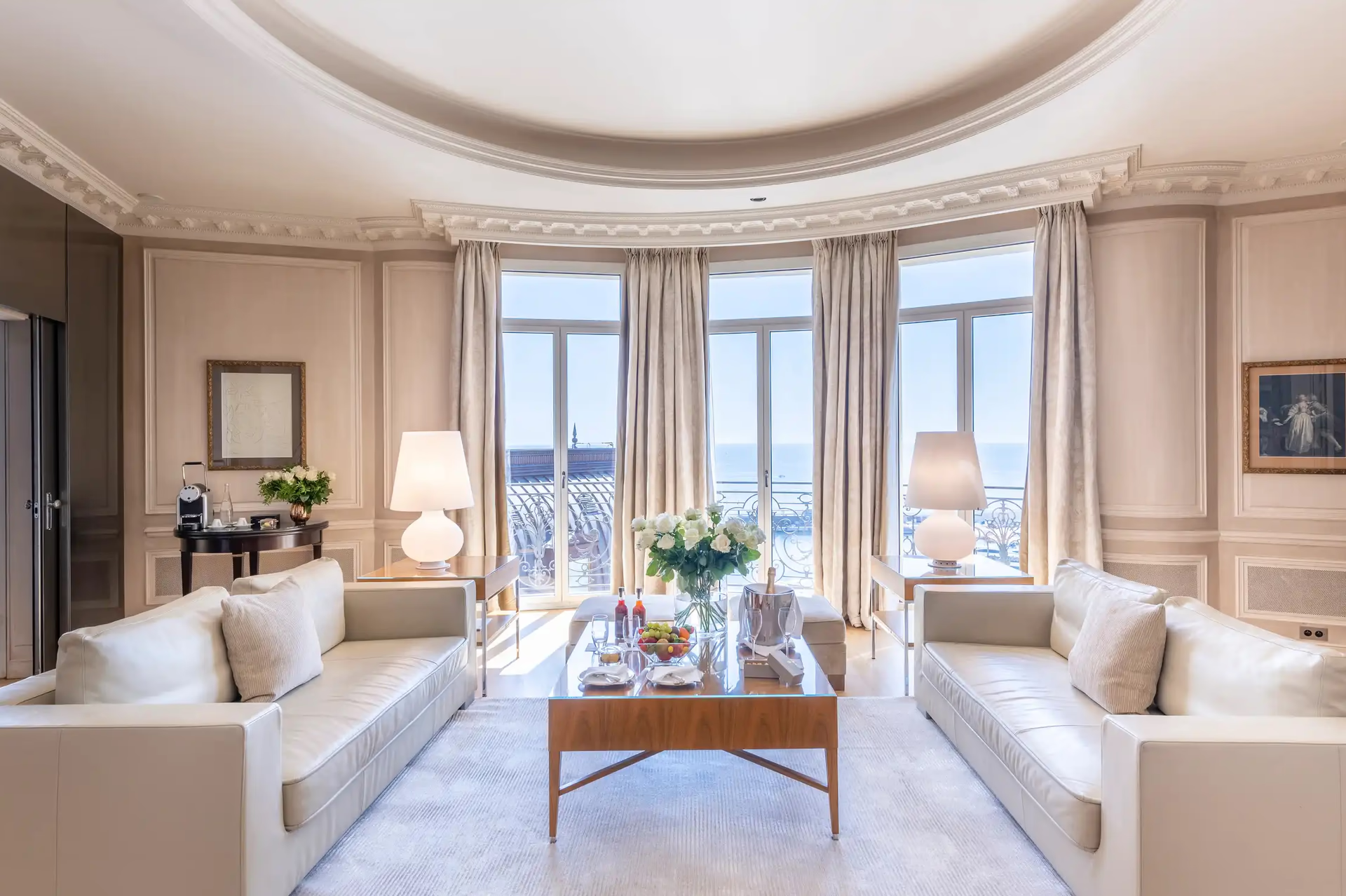 Hôtel Hermitage Monte-Carlo: formal sitting room with dual cream sofas, arched ceiling and wide glass doors to sea view