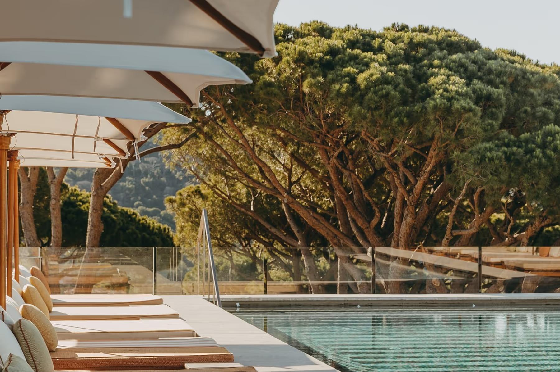 Lily of the Valley: pool deck lounge area with wooden pergola and sea view