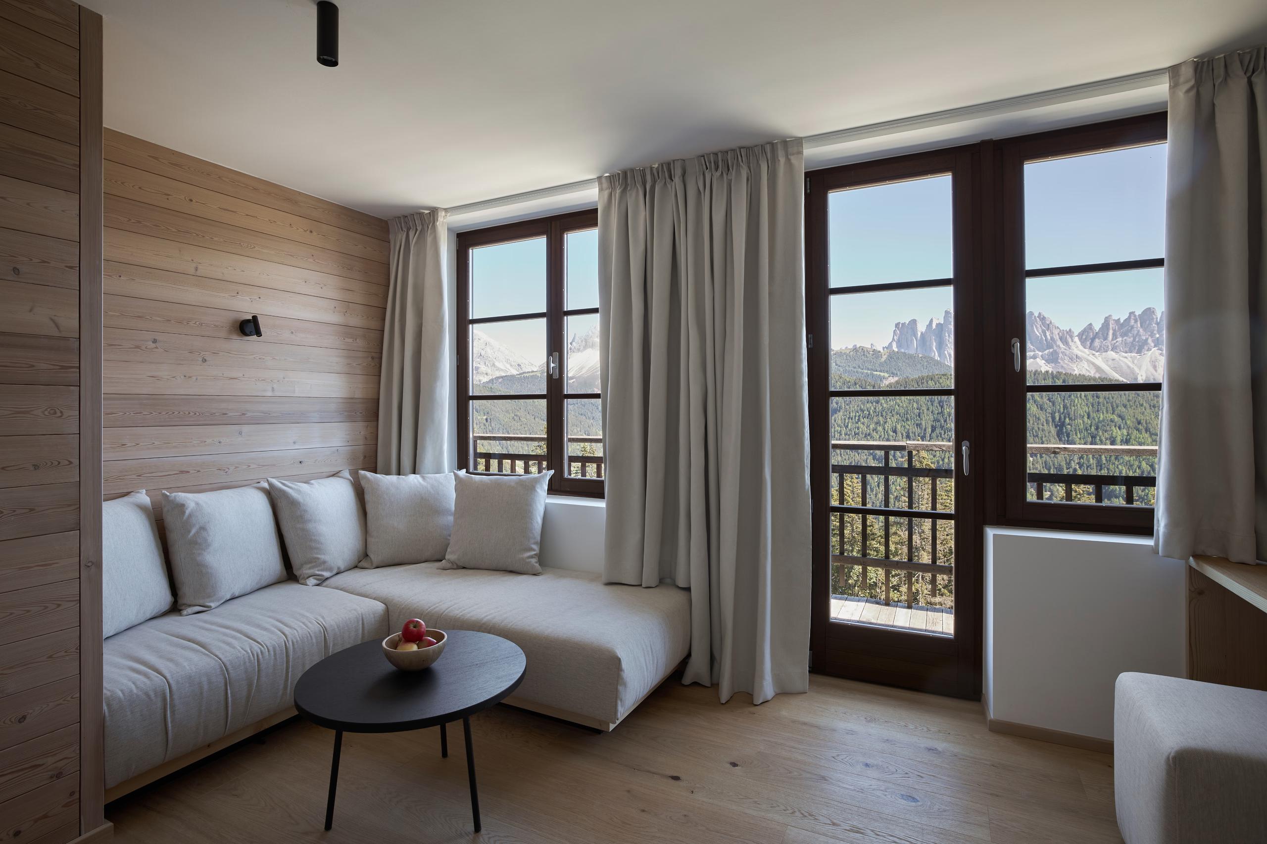 Forestis: a spa changing area with light wood and concrete walls, minimal design, and soft natural light
