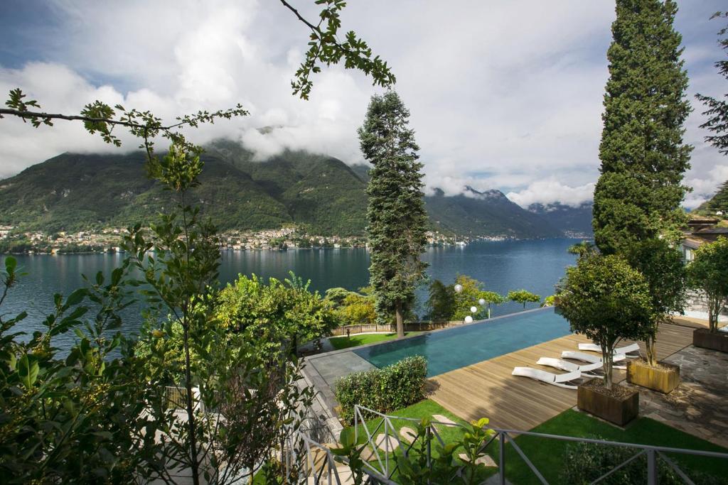 Villa Làrio: terraced infinity pool with lake and mountains beyond