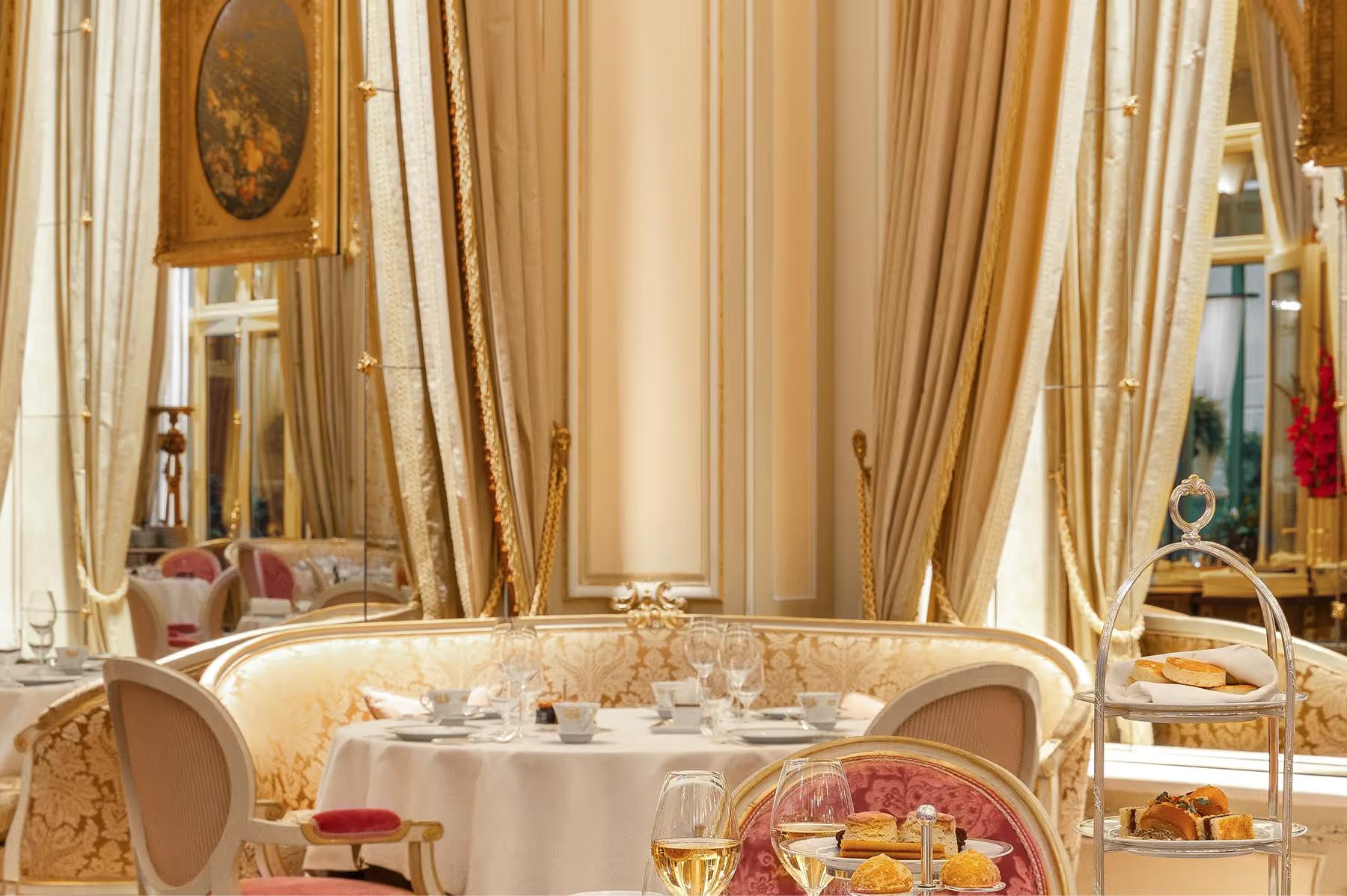 Ritz Paris: a breakfast service with chef in white toque, silver warming dome, and panoramic window views