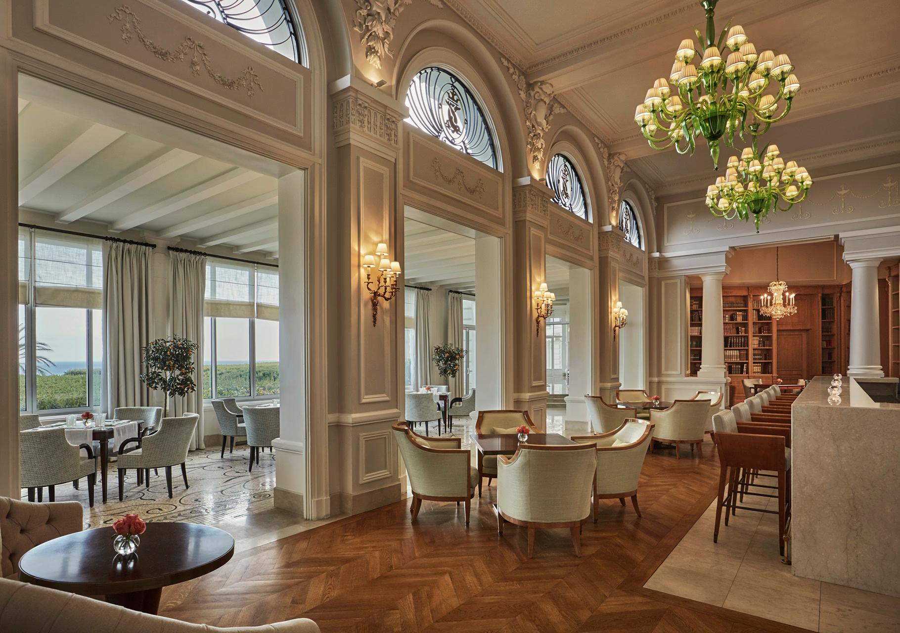 Grand-Hôtel du Cap-Ferrat: formal dining room with gilded mirrors, crystal chandelier, and cream moldings