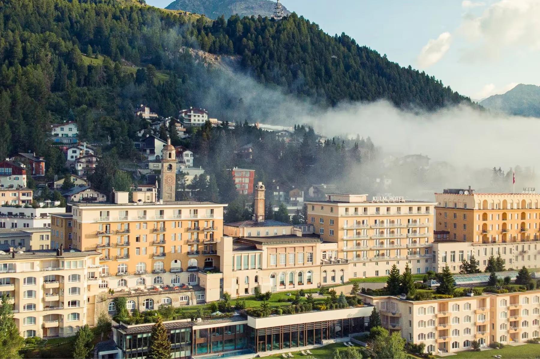 Kulm Hotel St. Moritz: the hotel’s honey-colored facade overlooks Lake St. Moritz with Alpine peaks beyond