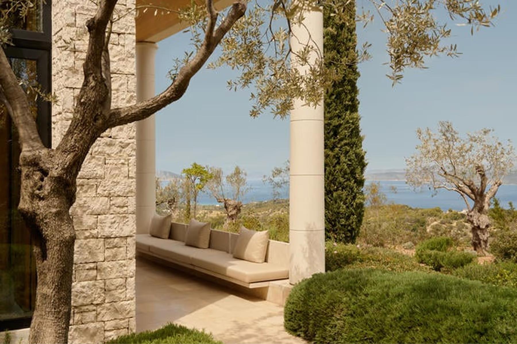 Amanzoe: columned structure with lounge chairs facing seascapes and distant islands