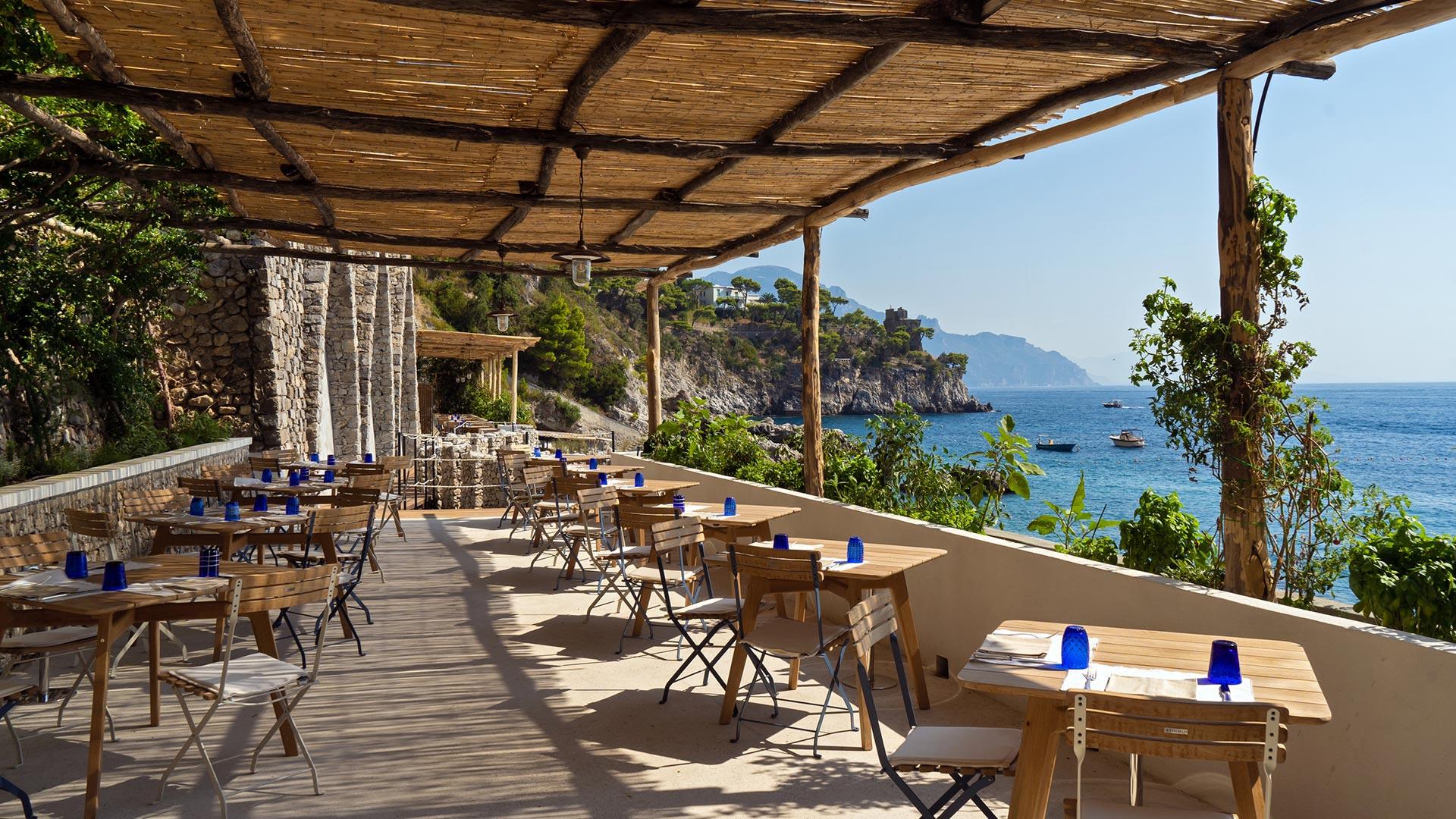 Borgo Santandrea: casual beachside trattoria with wooden tables and coastal mountain views
