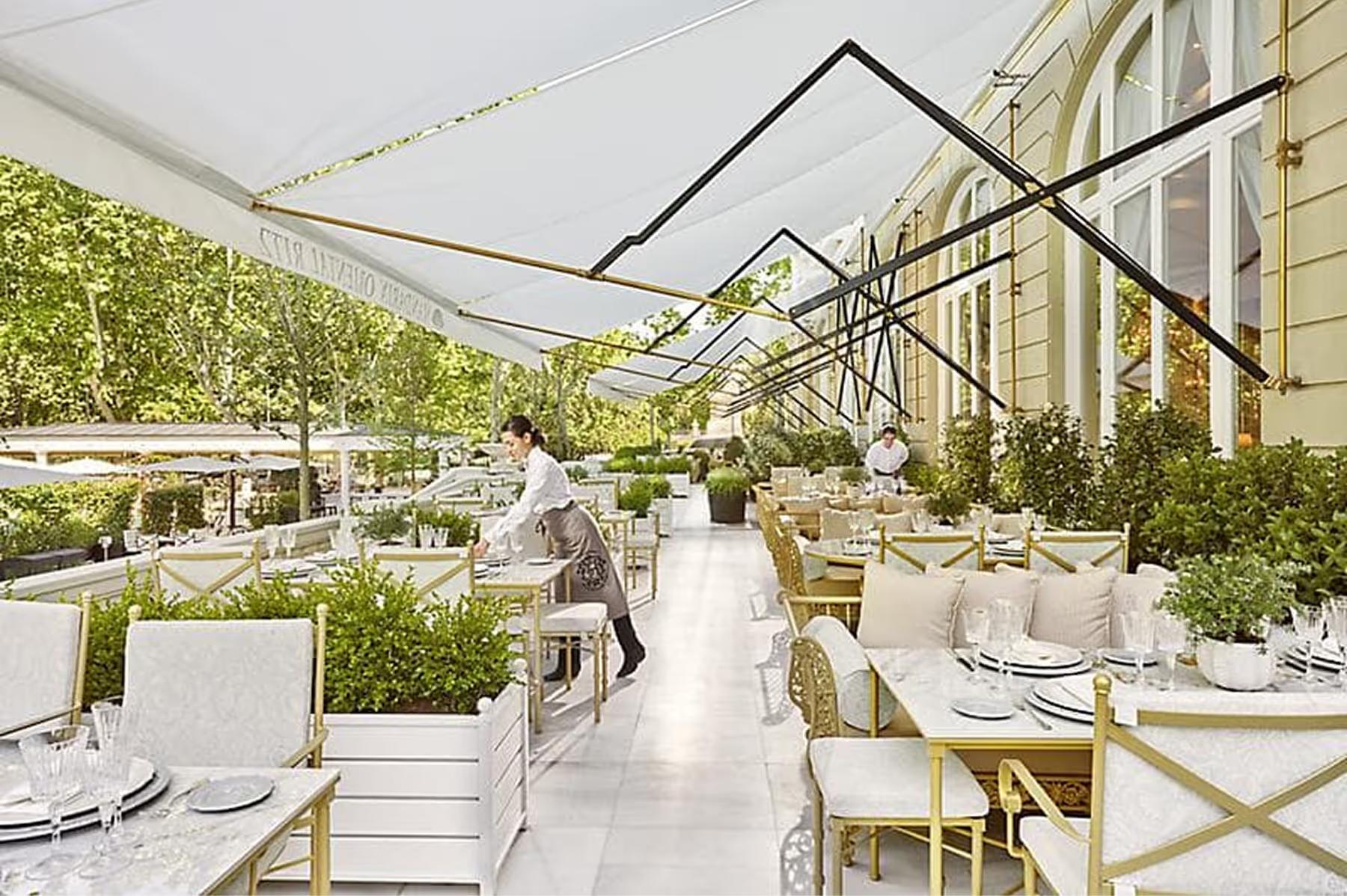 Mandarin Oriental Ritz, Madrid: terrace dining with retractable canopy and garden greenery views