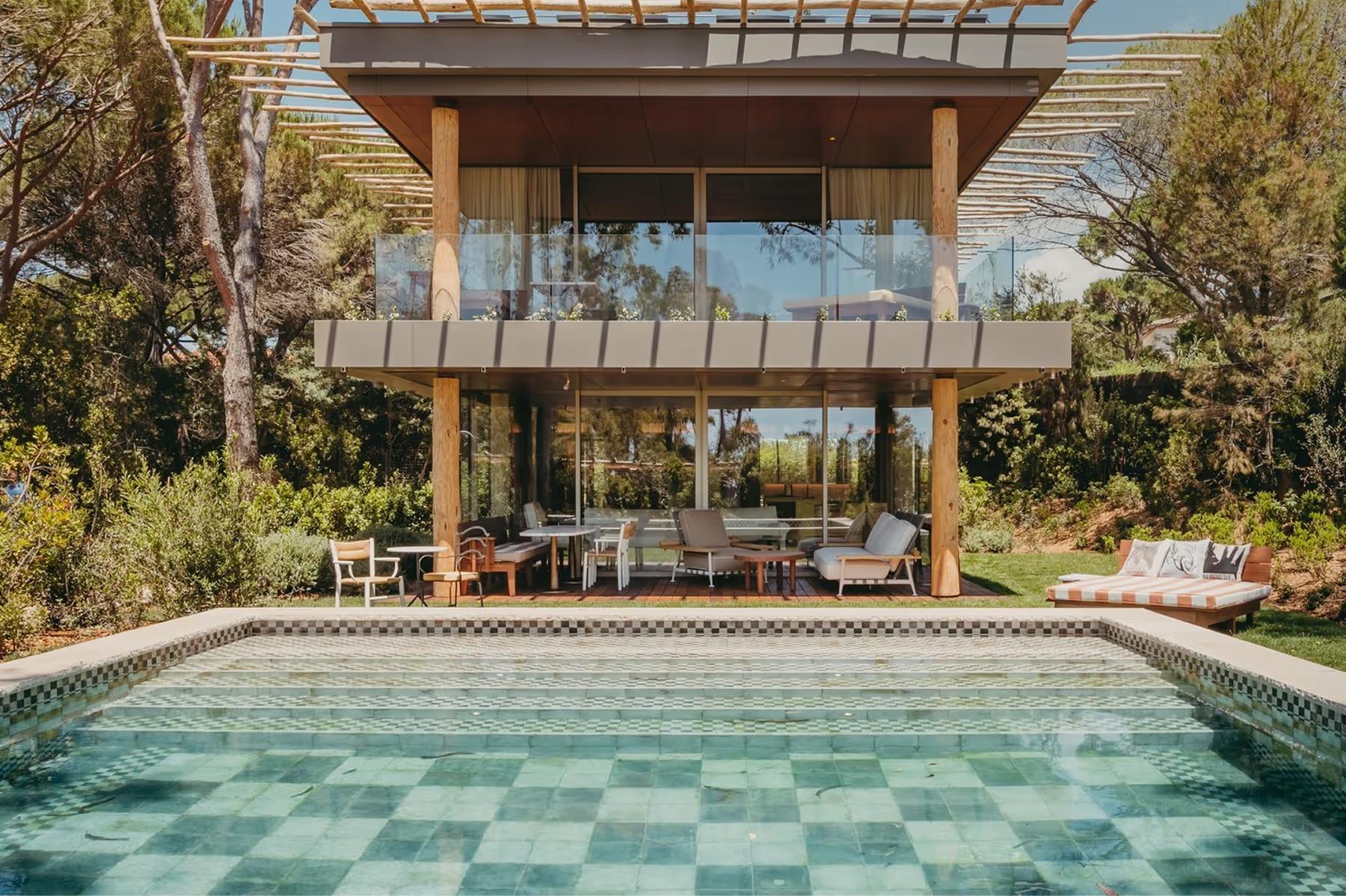 Lily of the Valley: two-story villa with pool featuring teal and white tile design