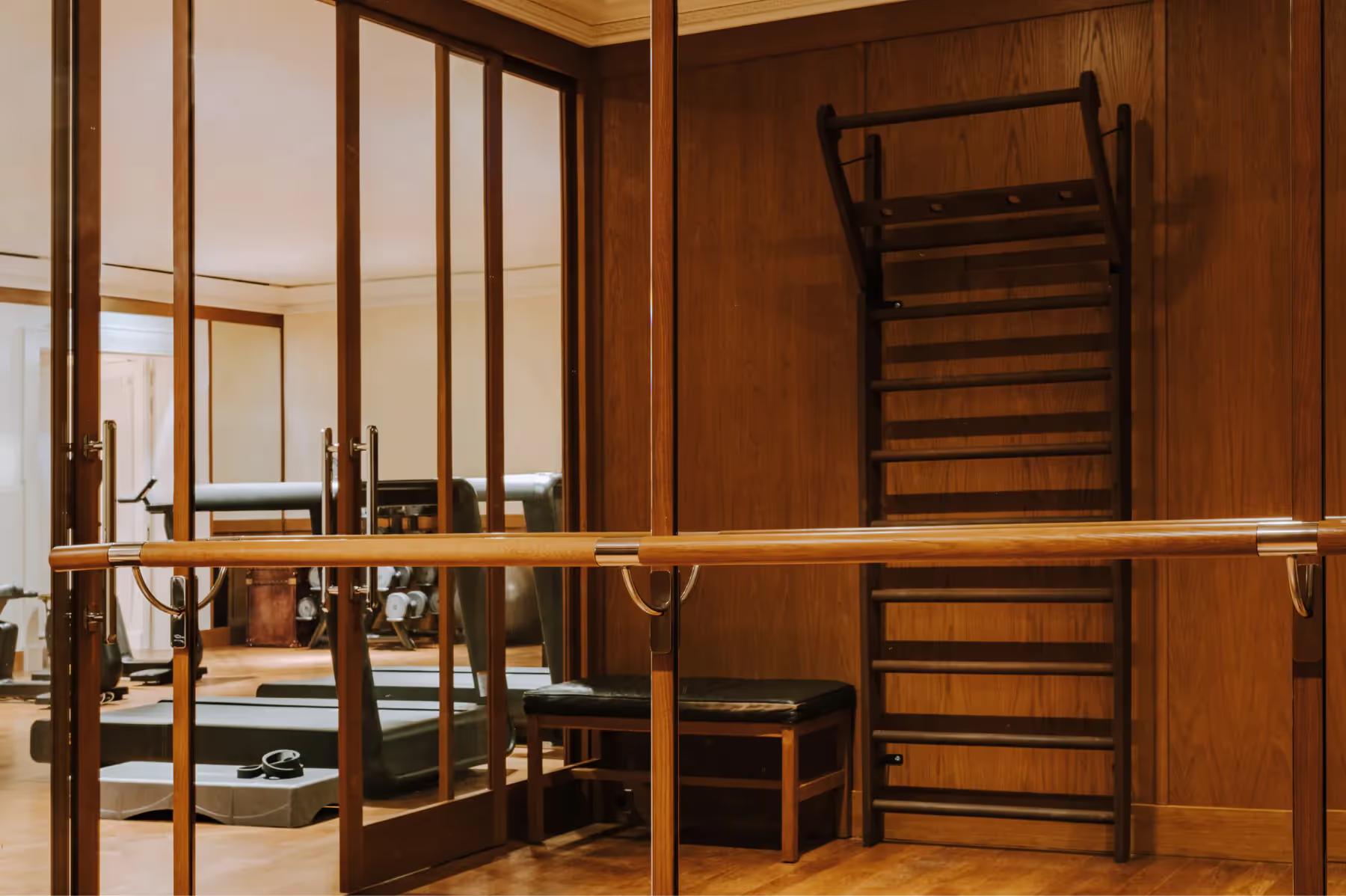 Saint James: spa facility with arched entryway, wood paneling, and dressing area