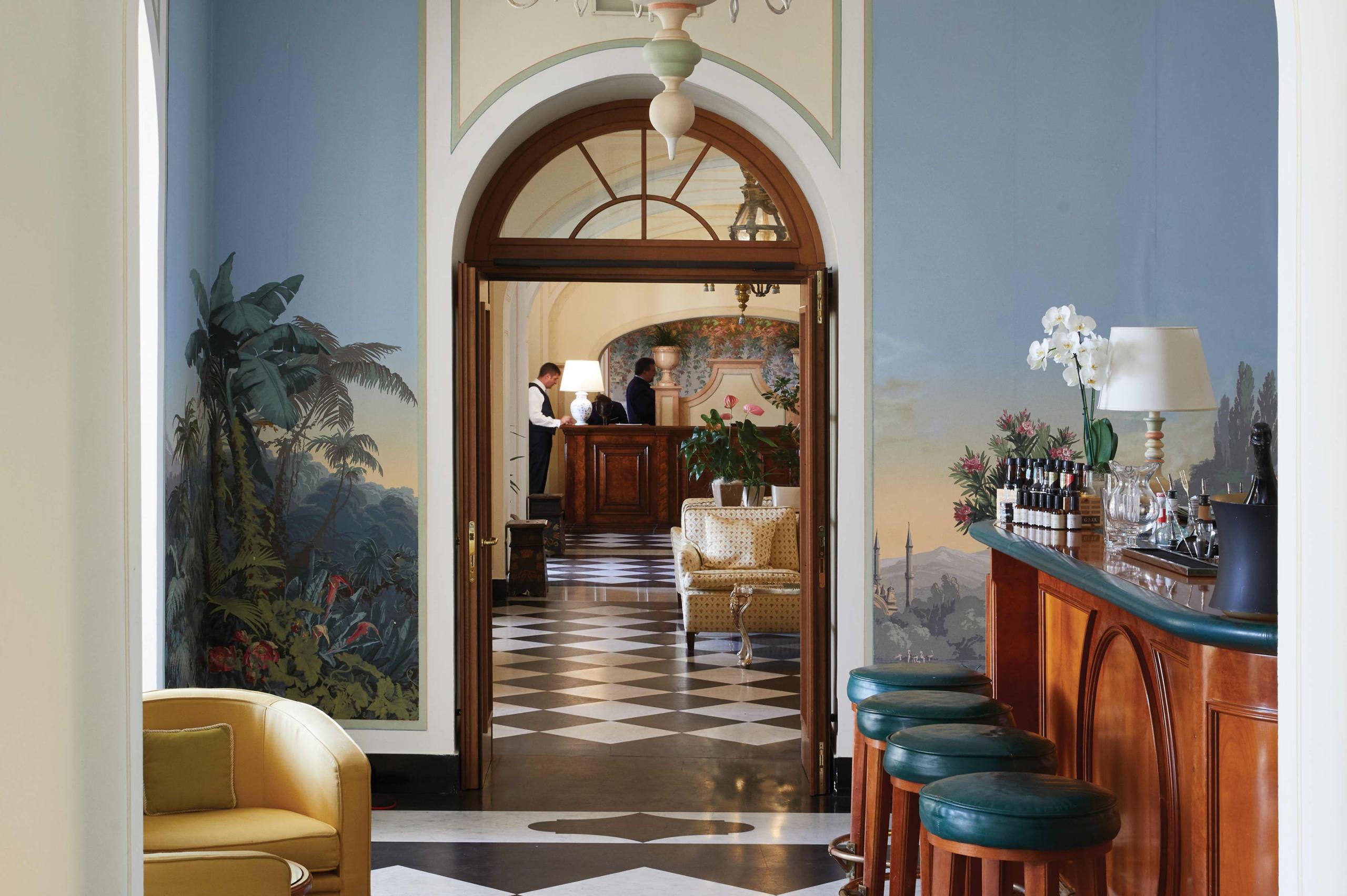 Splendido: an interior dining room with arched entry, traditional furnishings, and refined décor
