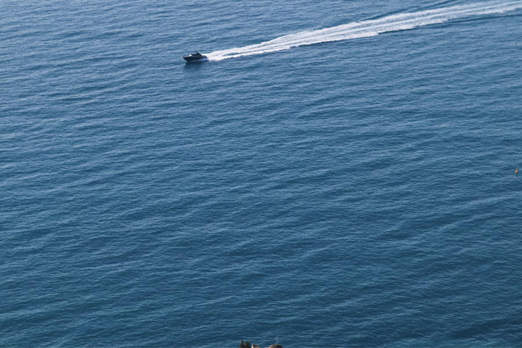 Maybourne Riviera: speedboat on blue water