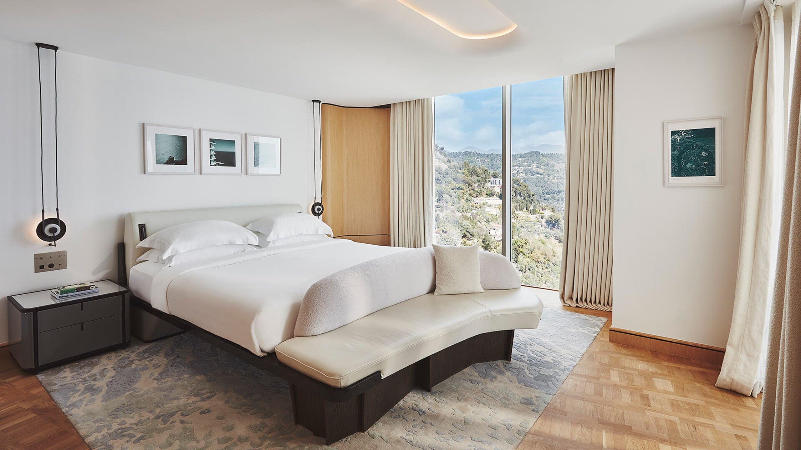 Maybourne Riviera: bedroom with wood paneling and contemporary furnishings