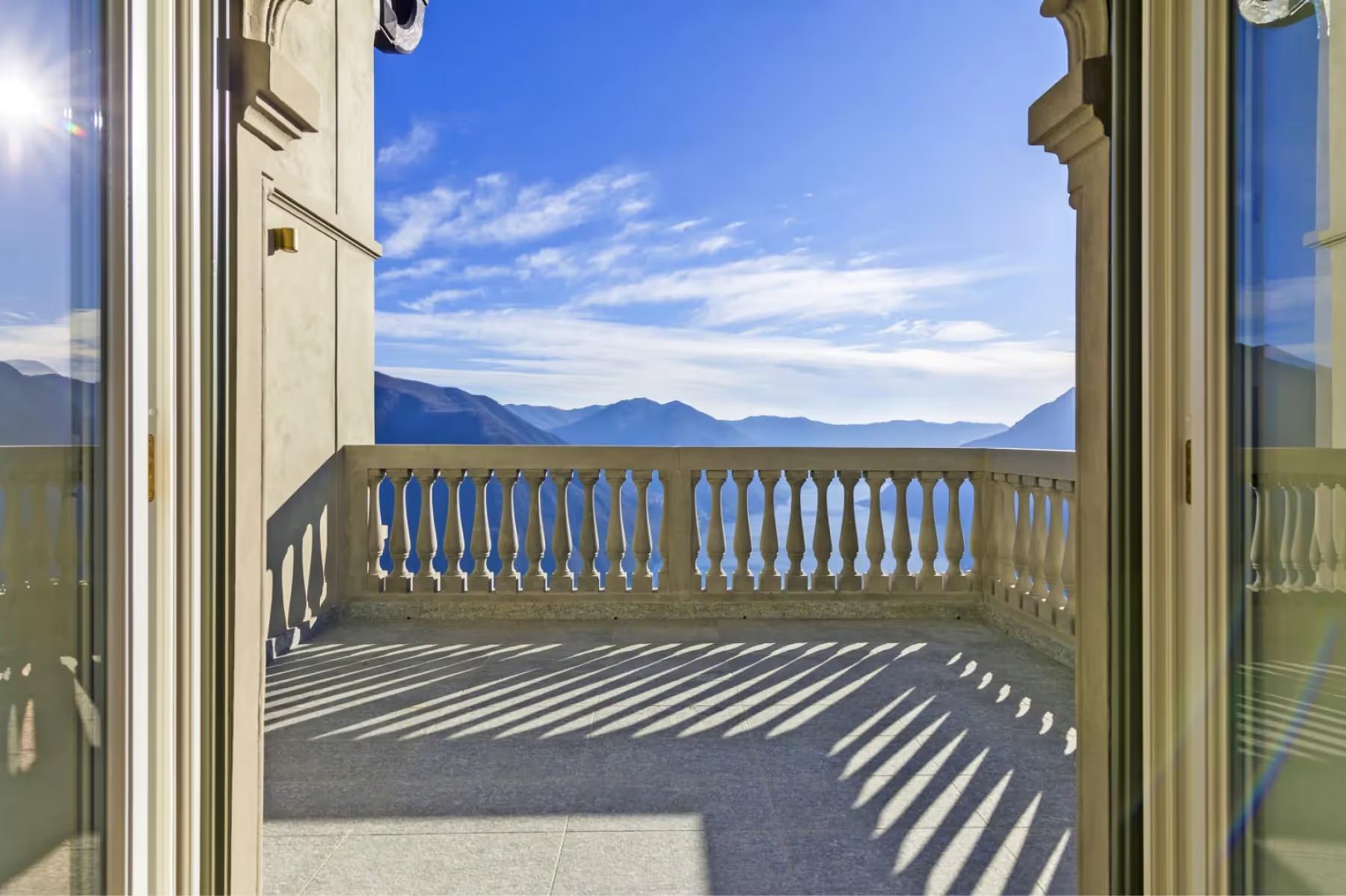 Villa Patrizia: large terrace doors framing sweeping lake and mountain views across Lake Como