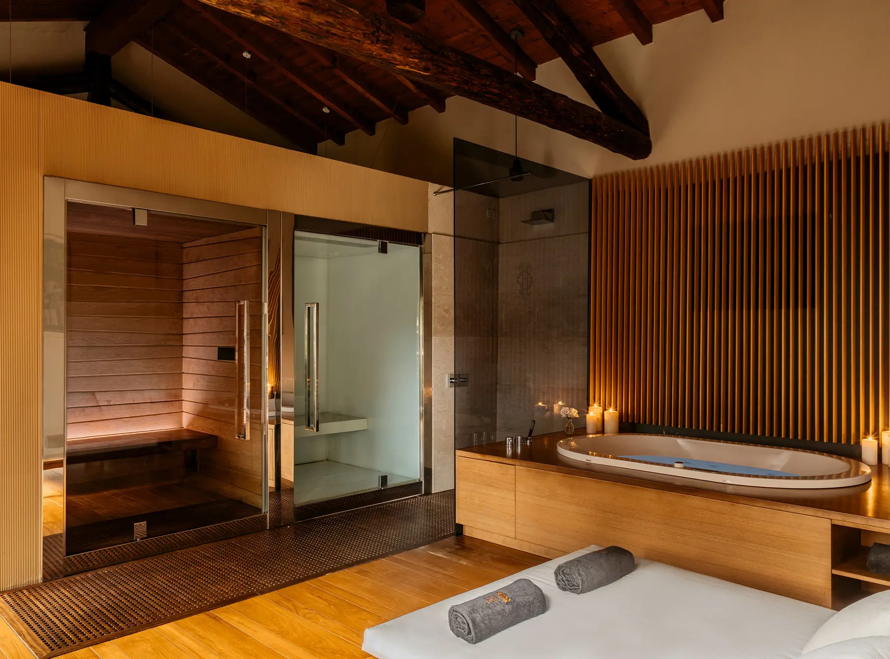 Grand Hotel Tremezzo: spa area with sauna entrance, wood finishes, and stone accents