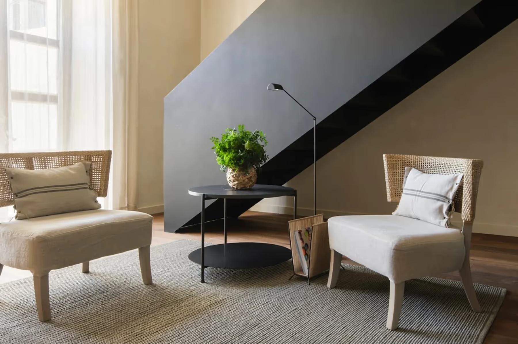Can Ferrereta: suite interior with warm lighting and curated furnishings