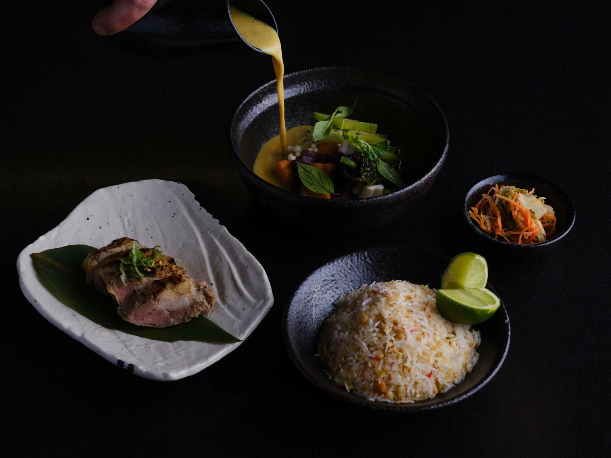 Artfully presented four-course tasting dishes with seafood, rice, and vegetable components