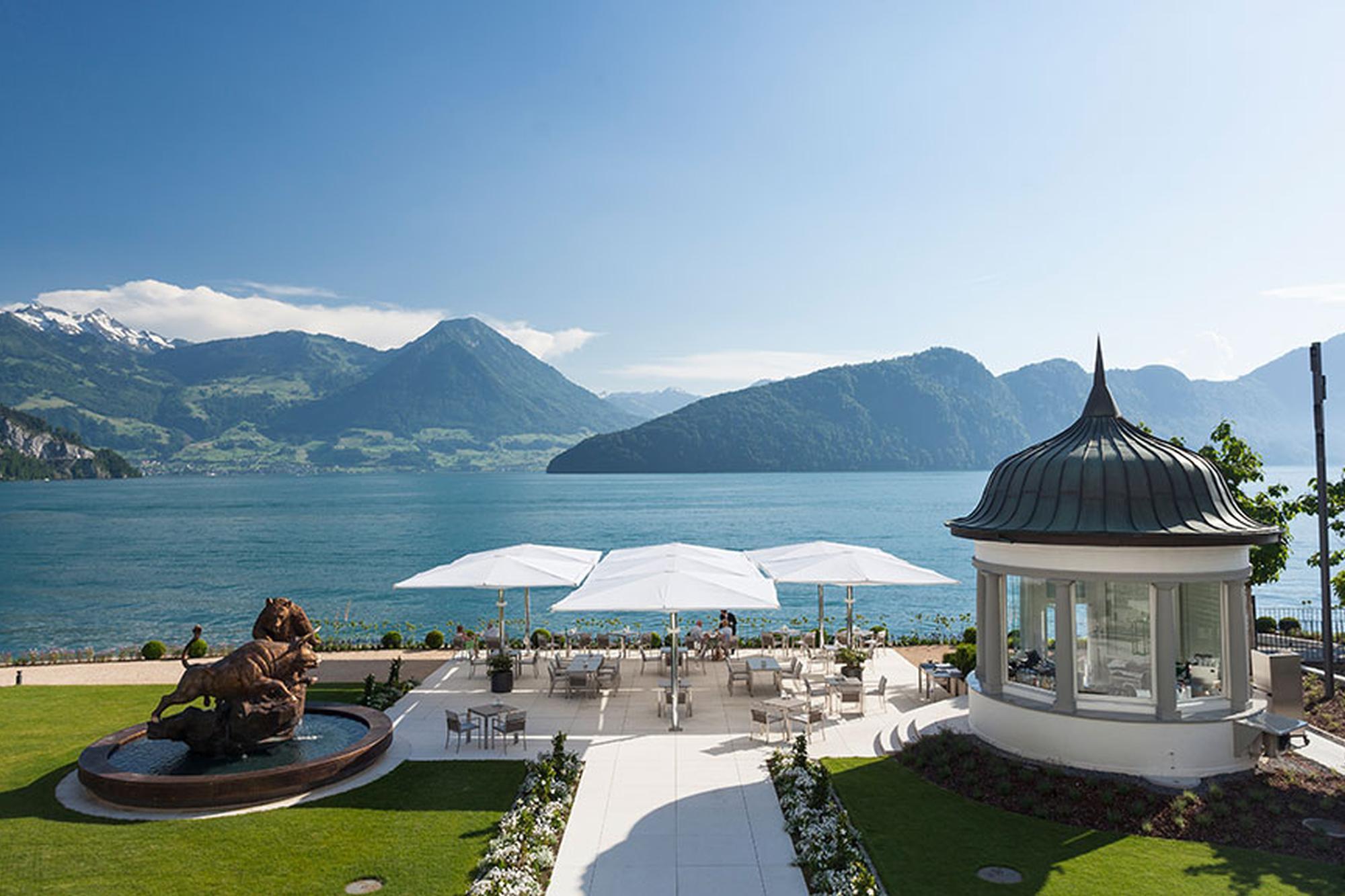 Park Hotel Vitznau: manicured lawn with architectural gazebo and Alpine mountain vista