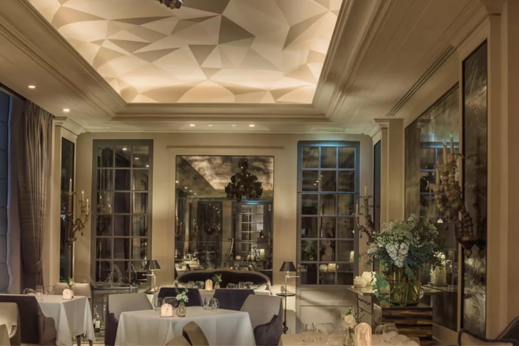 Hôtel de Crillon: bright gallery space with white linens, mirrors, and classical architectural details