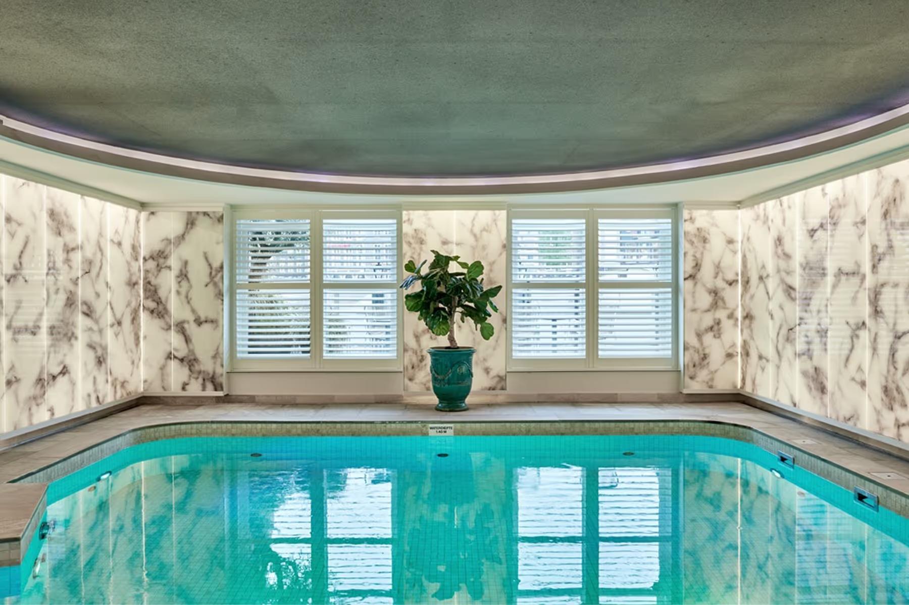 Spa hallway with warm wood accents and natural light from clerestory windows
