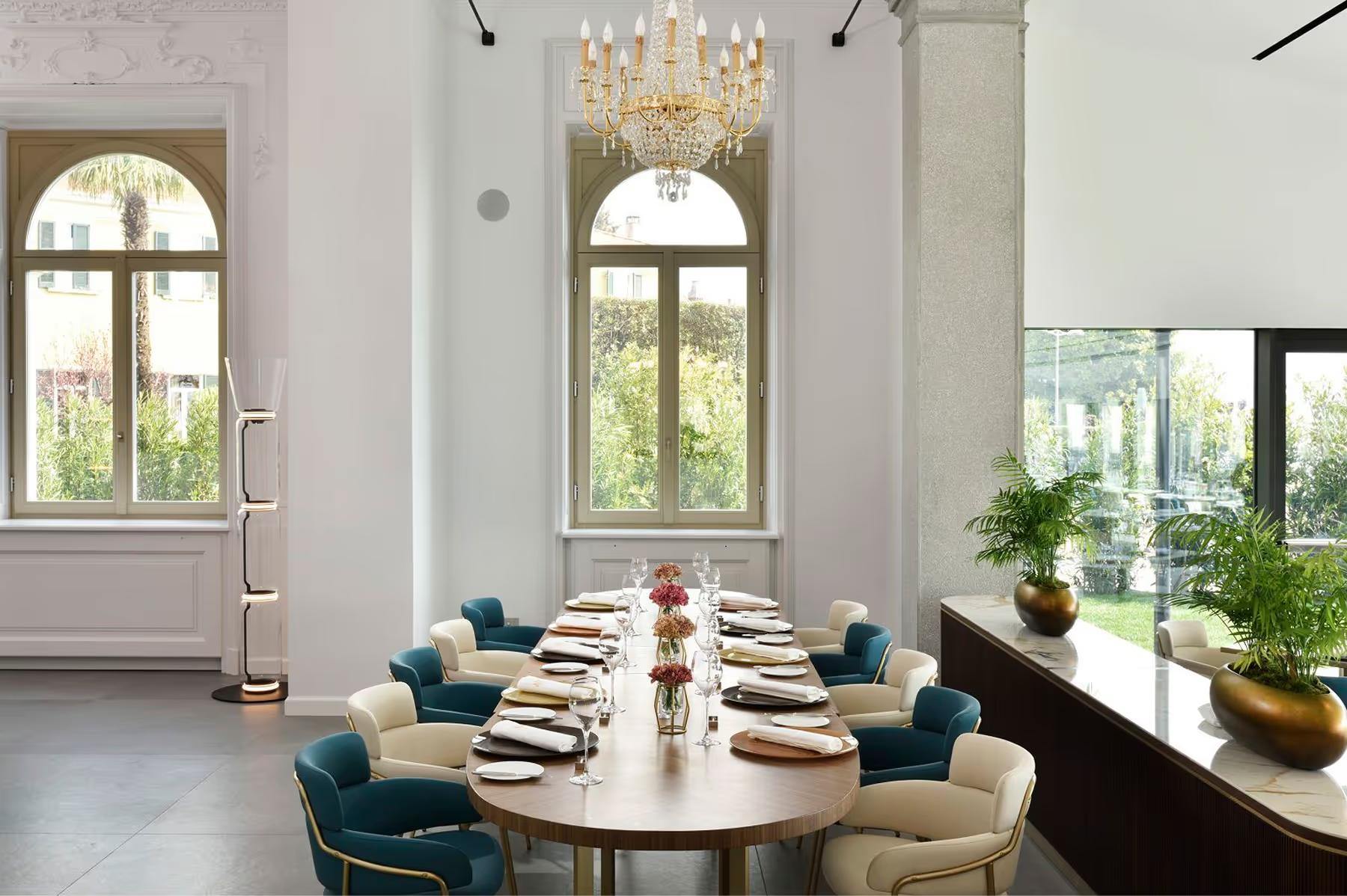 Grand Hotel Victoria Concept & Spa: a wine cellar with tall glass doors and modern furnishings in white and cream