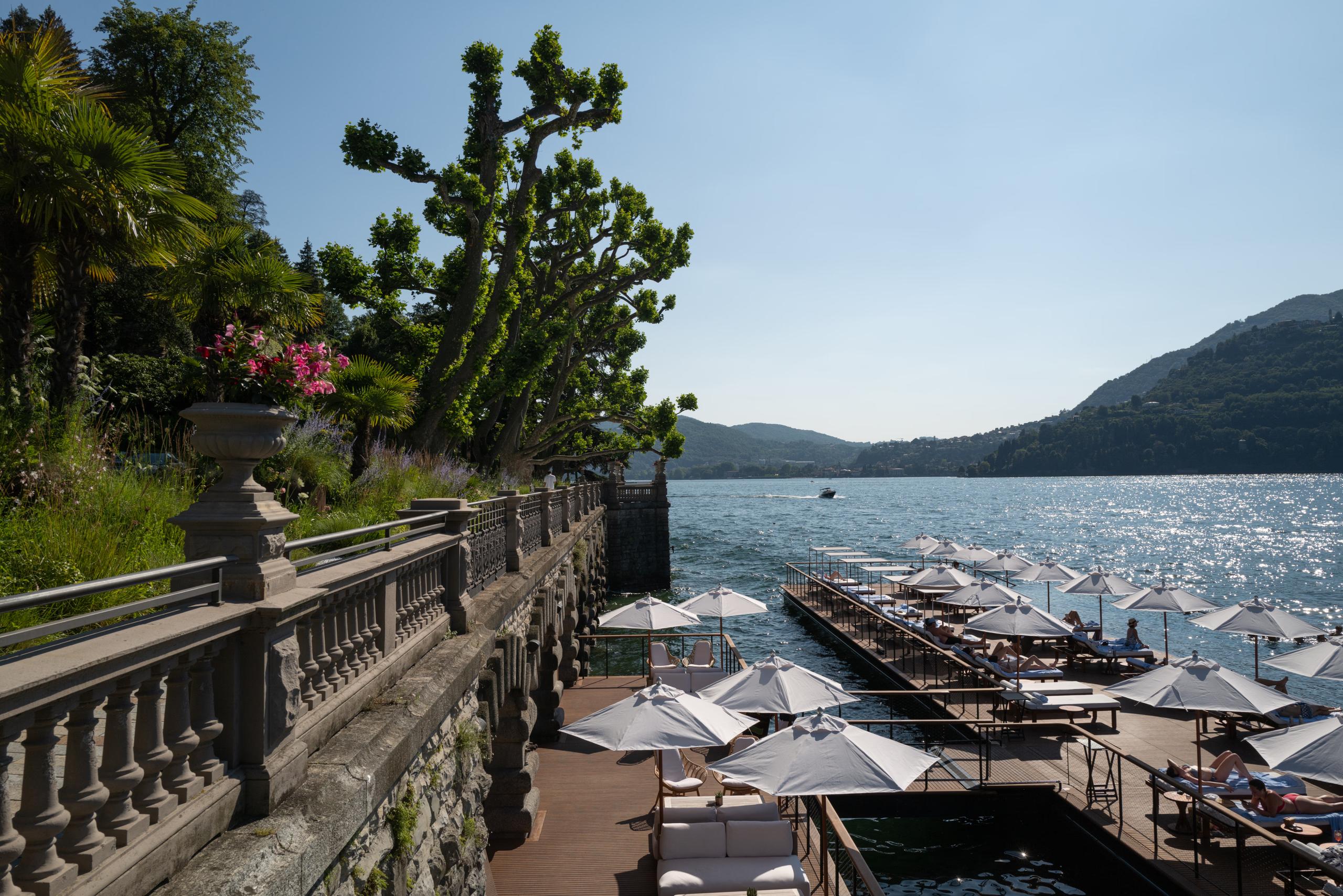 Mandarin Oriental, Lake Como: water’s edge with manicured shrubs, lake access platforms, and distant mountains