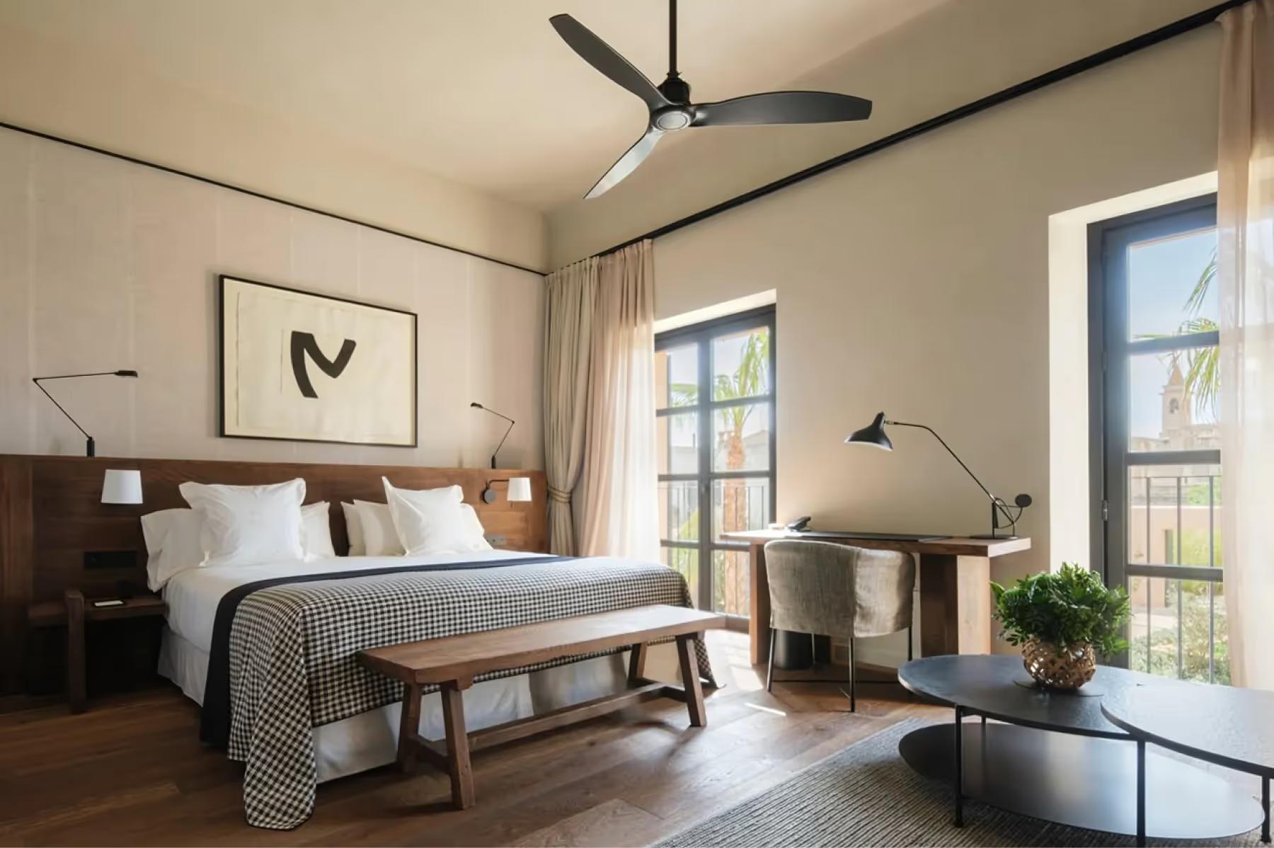 Can Ferrereta: guest bedroom with neutral palette and large windows