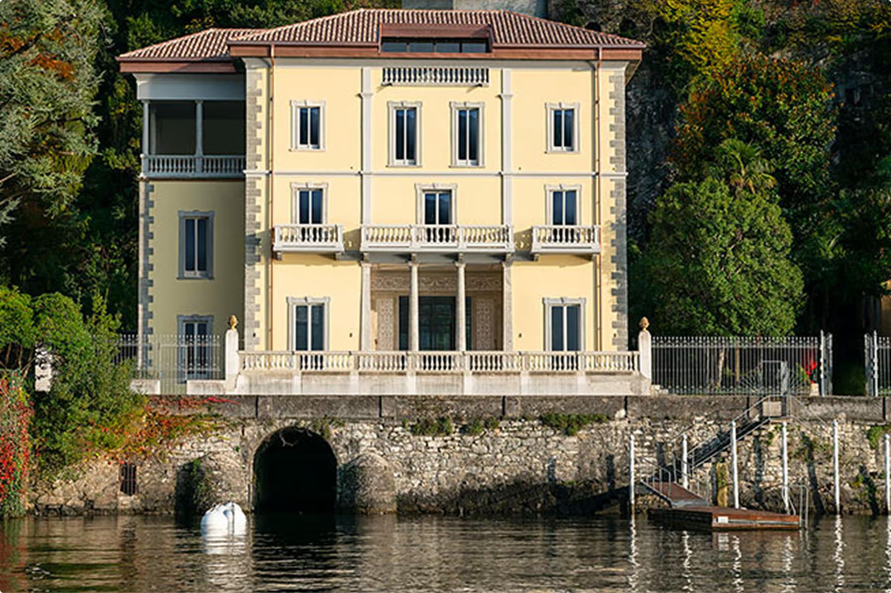 Villa Làrio: pale yellow neoclassical villa with arched windows reflected in the lake
