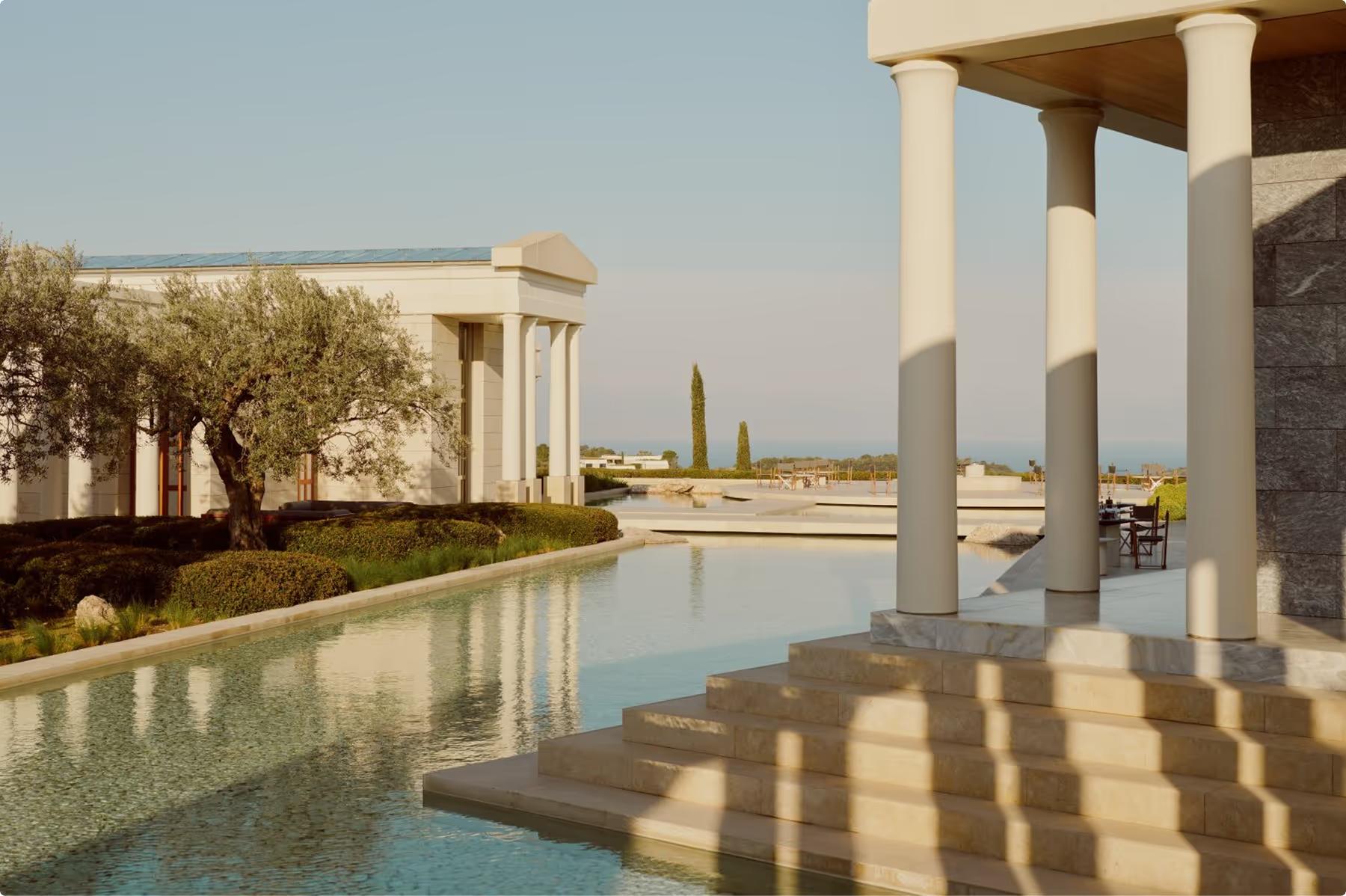 Covered lounge area with cypress plantings and sea views