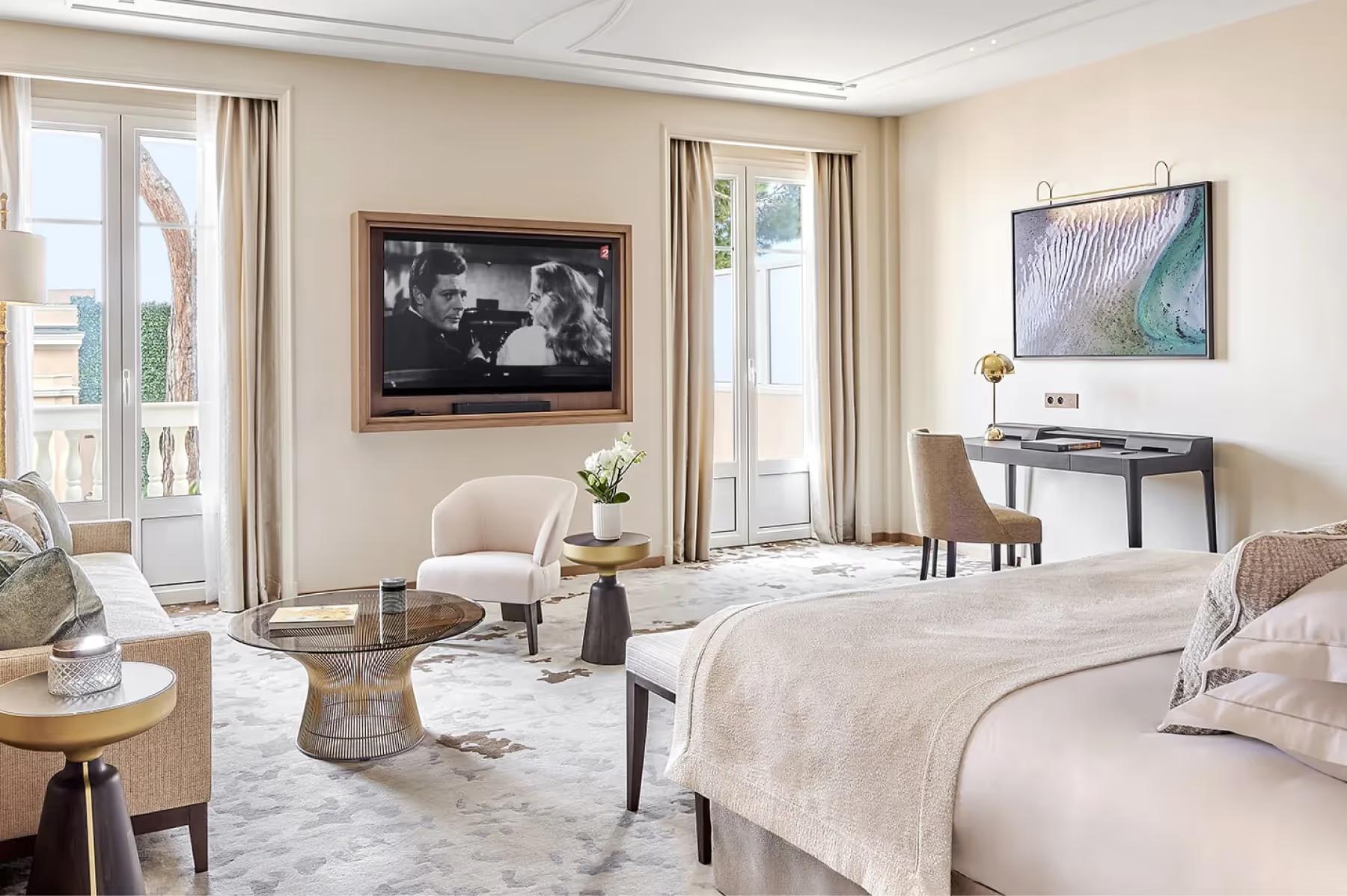 La Réserve de Beaulieu: bedroom with two queen beds, neutral tones, and views to the terrace