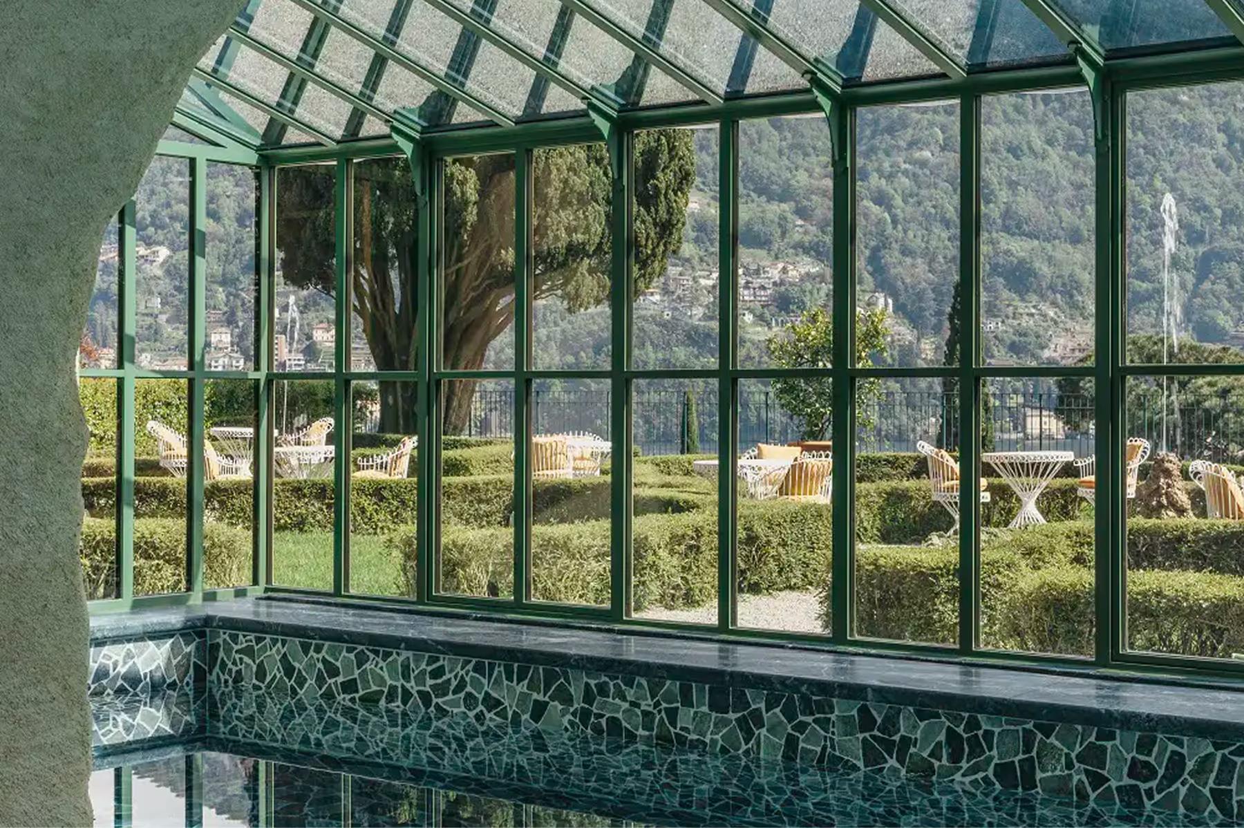 Passalacqua: large windows framing an expansive view of terraced grounds and distant lake