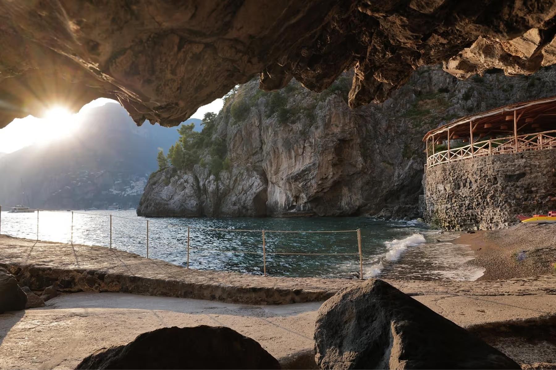 Private cove with natural rock formations, sea access, sand beach, and cliff edges