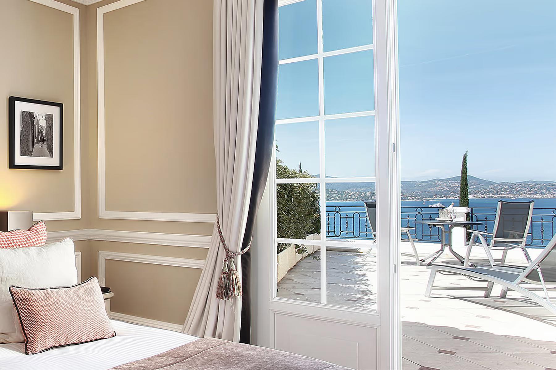 Althoff Villa Belrose: bedroom with open glass doors to a balcony and white drapery