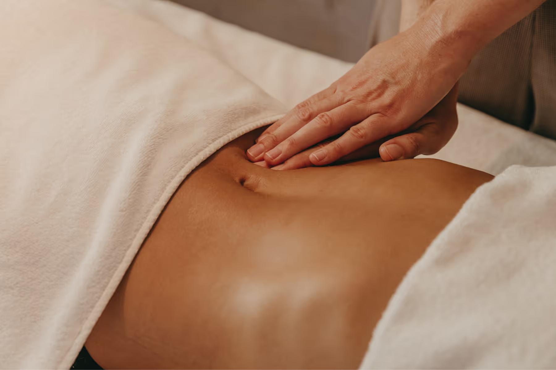 Lily of the Valley: hands performing massage therapy on client back