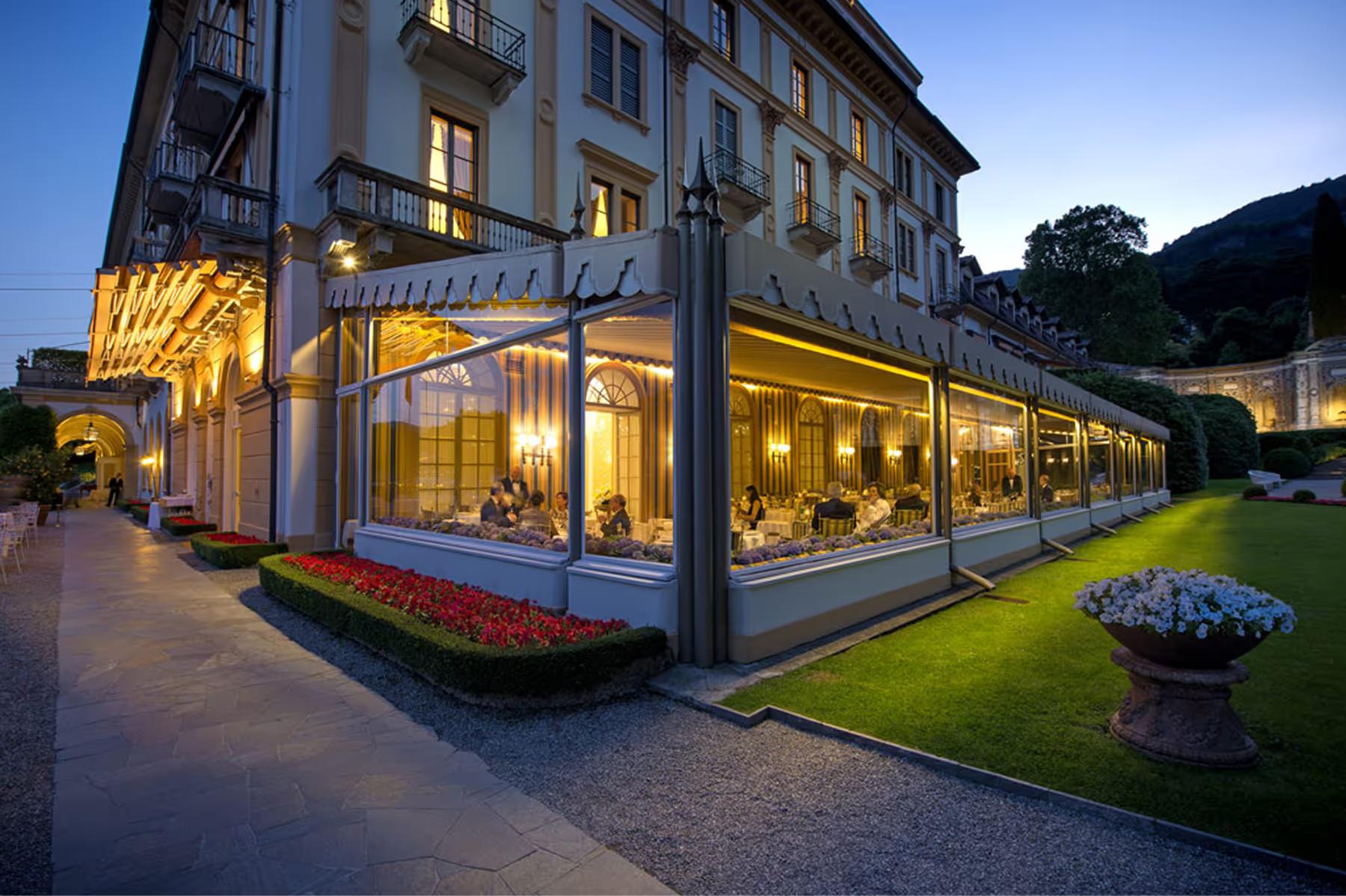 Villa d’Este: evening outdoor terrace dining overlooking the illuminated lake