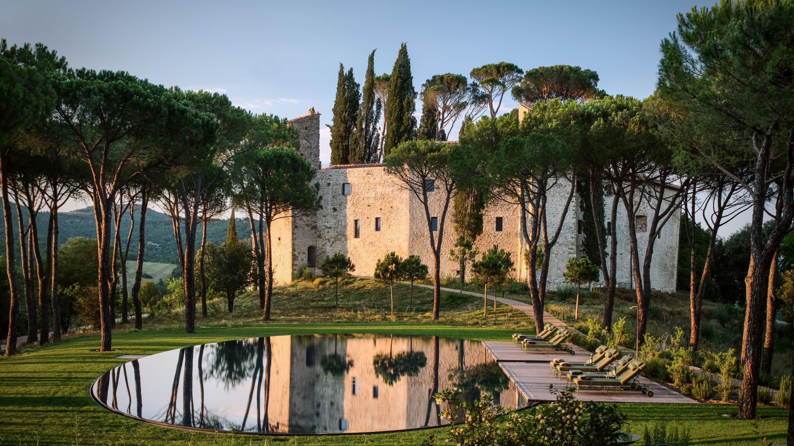 The thousand-year-old castle and reflecting pool at Castello di Reschio
