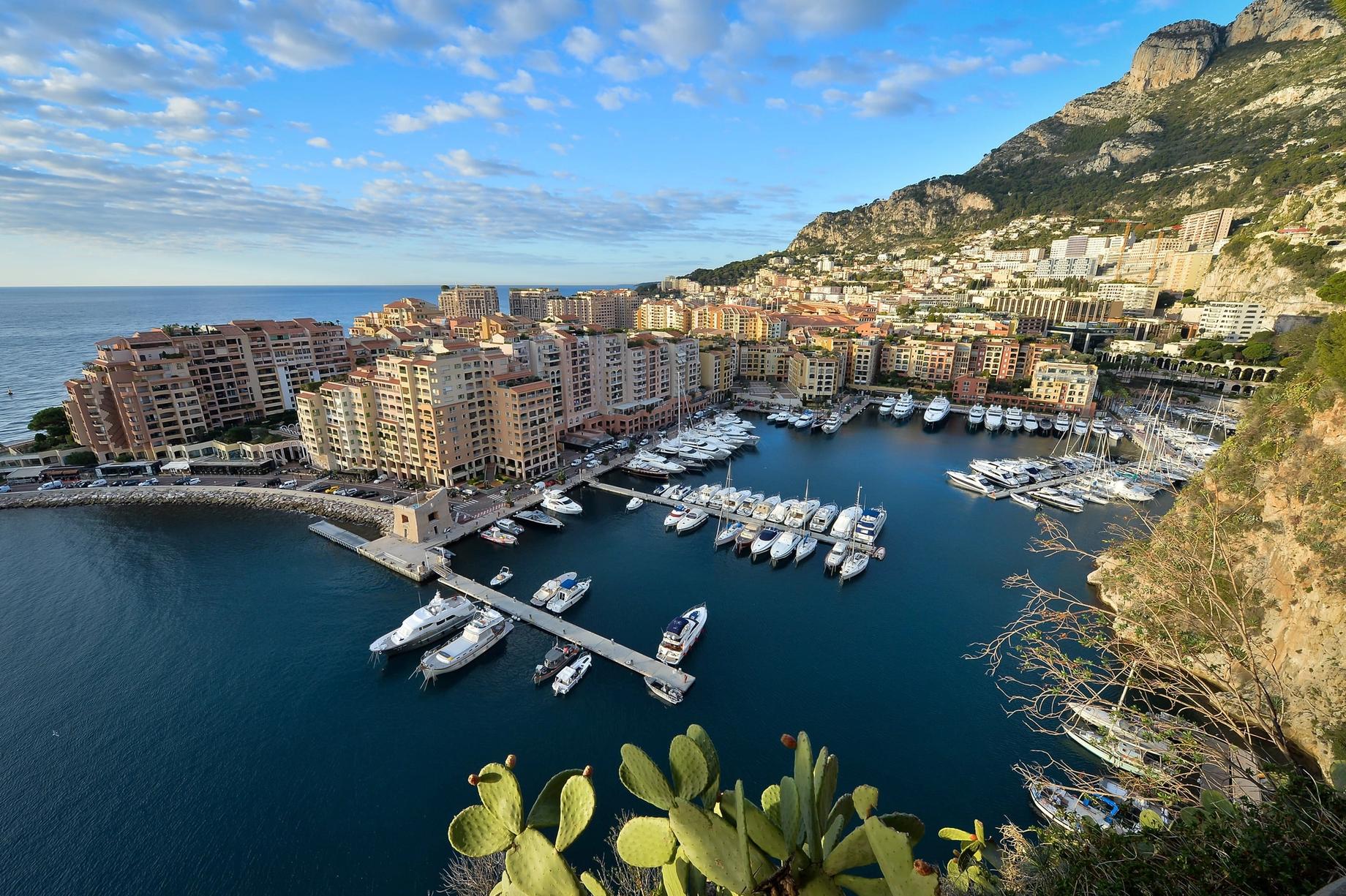 Yachts moored in the Fontvieille harbour below the Monte-Carlo hills