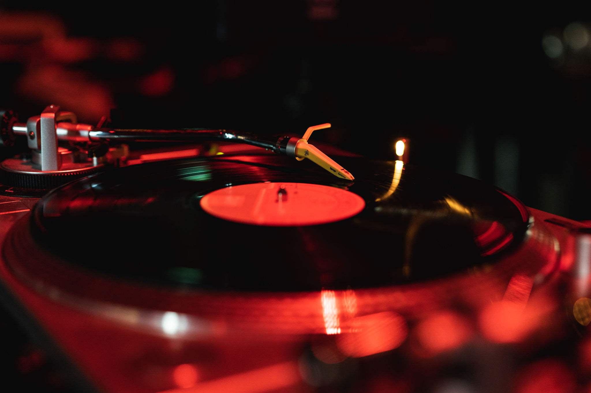 Mandarin Oriental Conservatorium, Amsterdam: turntable with a black record and a red label, in dim red light