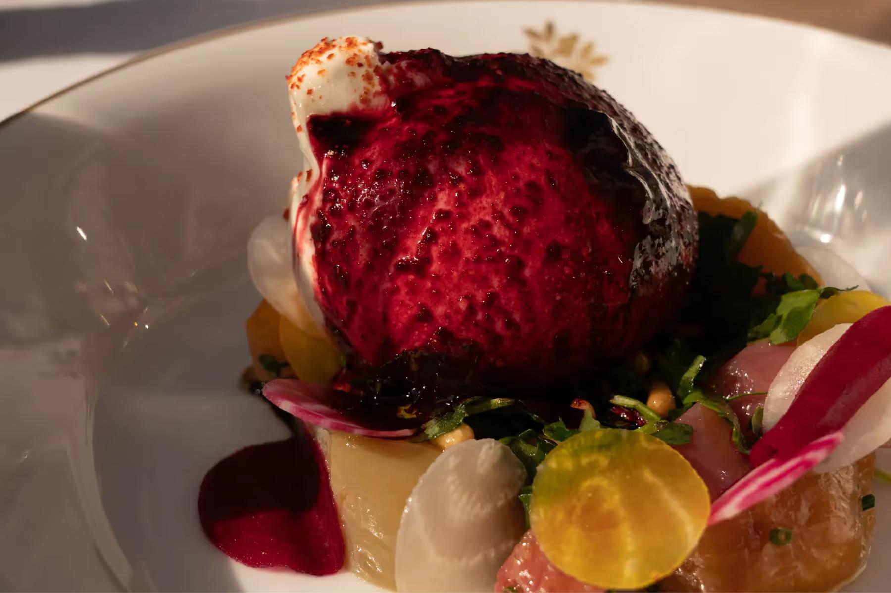 Airelles Gordes, La Bastide: artistic plated dish with dark berry mousse and candied garnish
