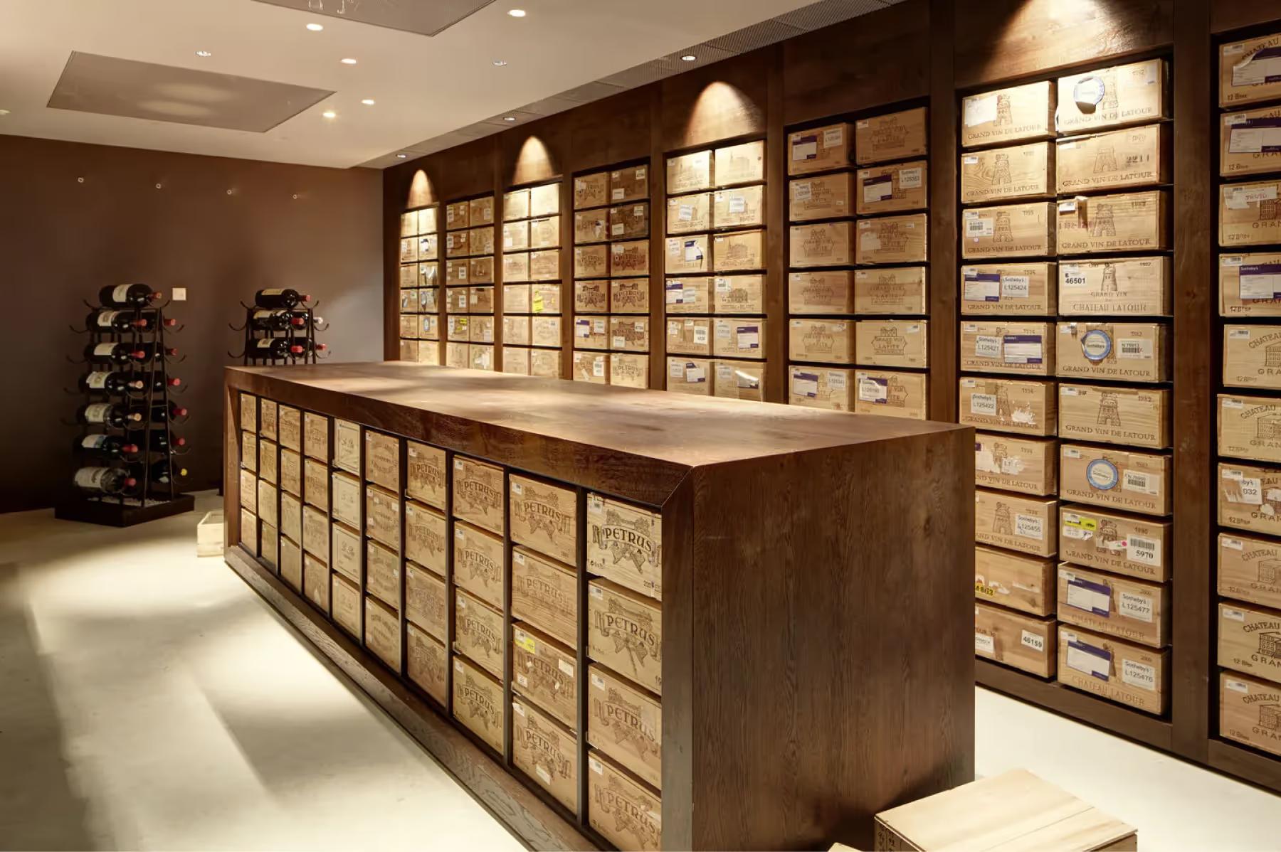 Park Hotel Vitznau: wine cellar with glass storage walls and wooden display counter