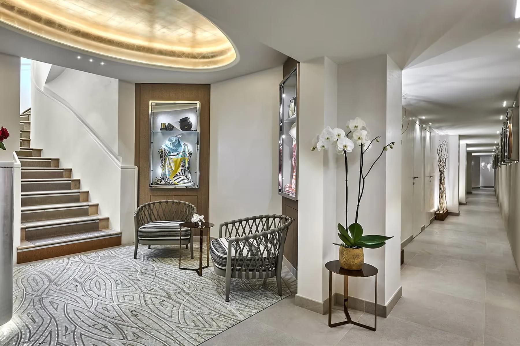 Hotel lobby with curved staircase and classical architecture