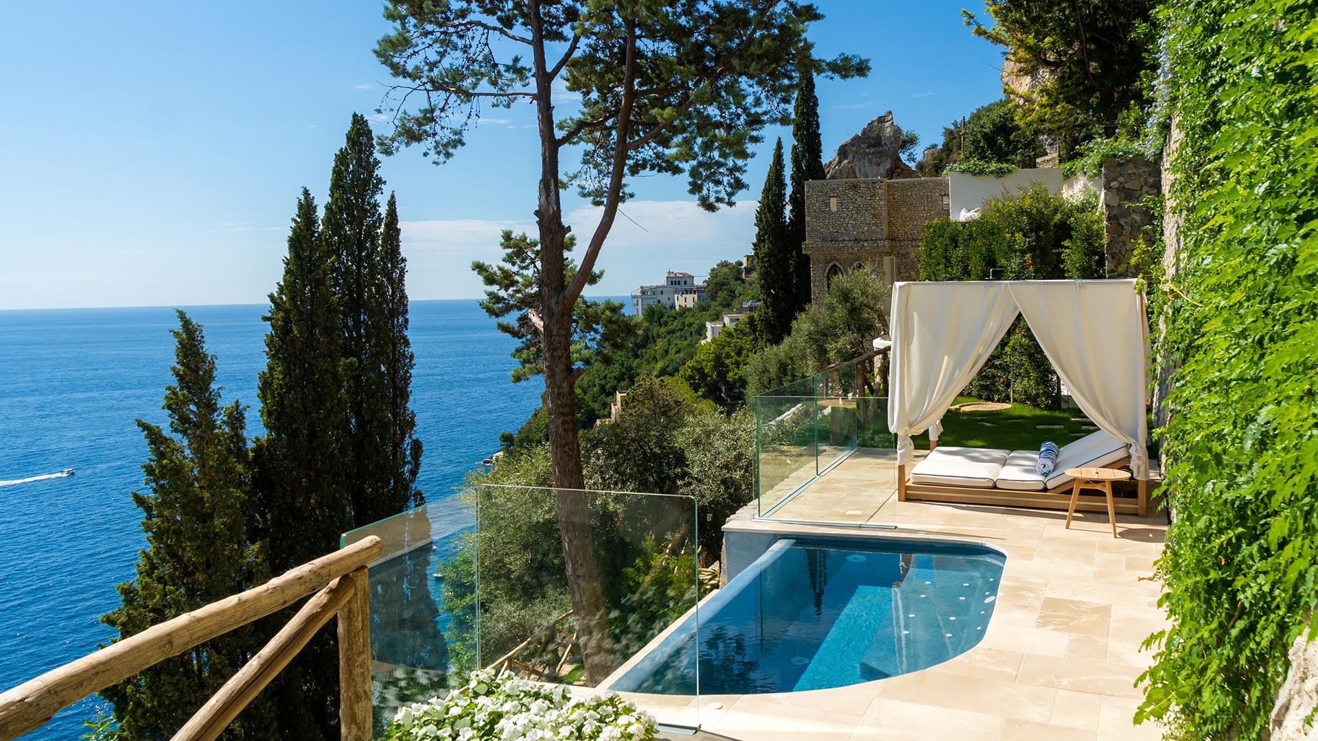 Borgo Santandrea: private suite with infinity pool on clifftop terrace surrounded by cypress trees