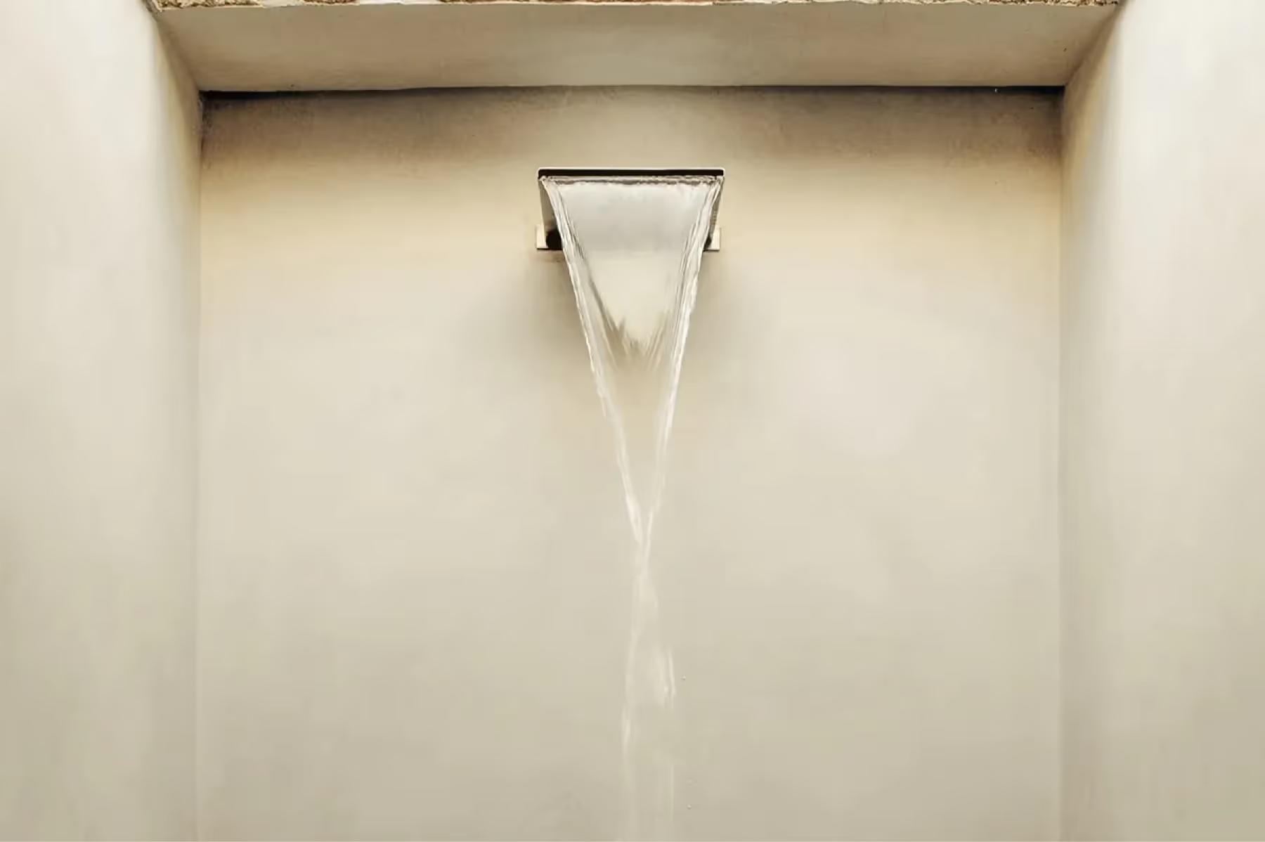Minimalist interior view of architectural window frame casting clean shadow on plaster wall