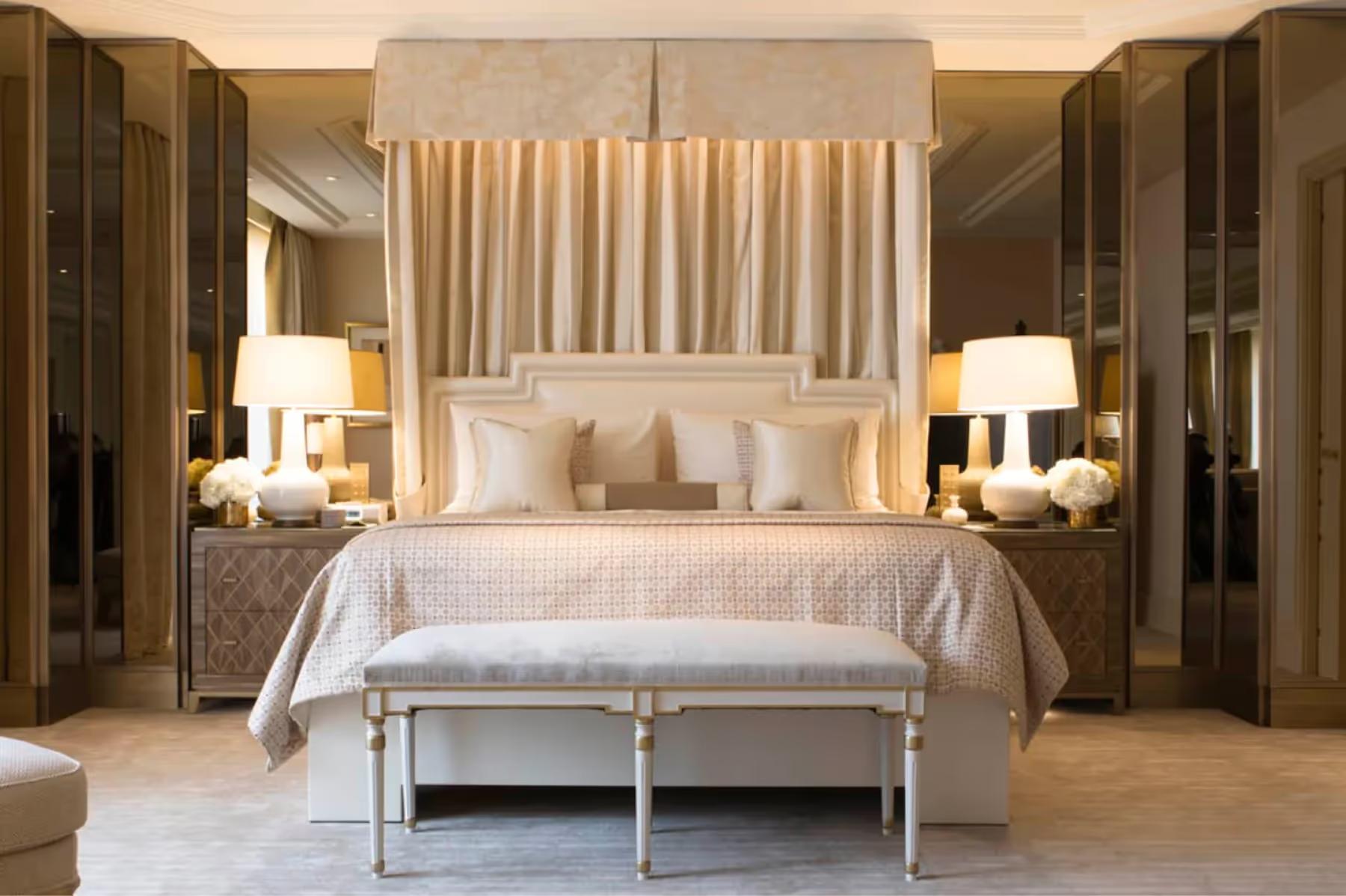 Four Seasons Hotel George V: a grand suite with coffered ceiling, gilt furniture, and elegant cream upholstery