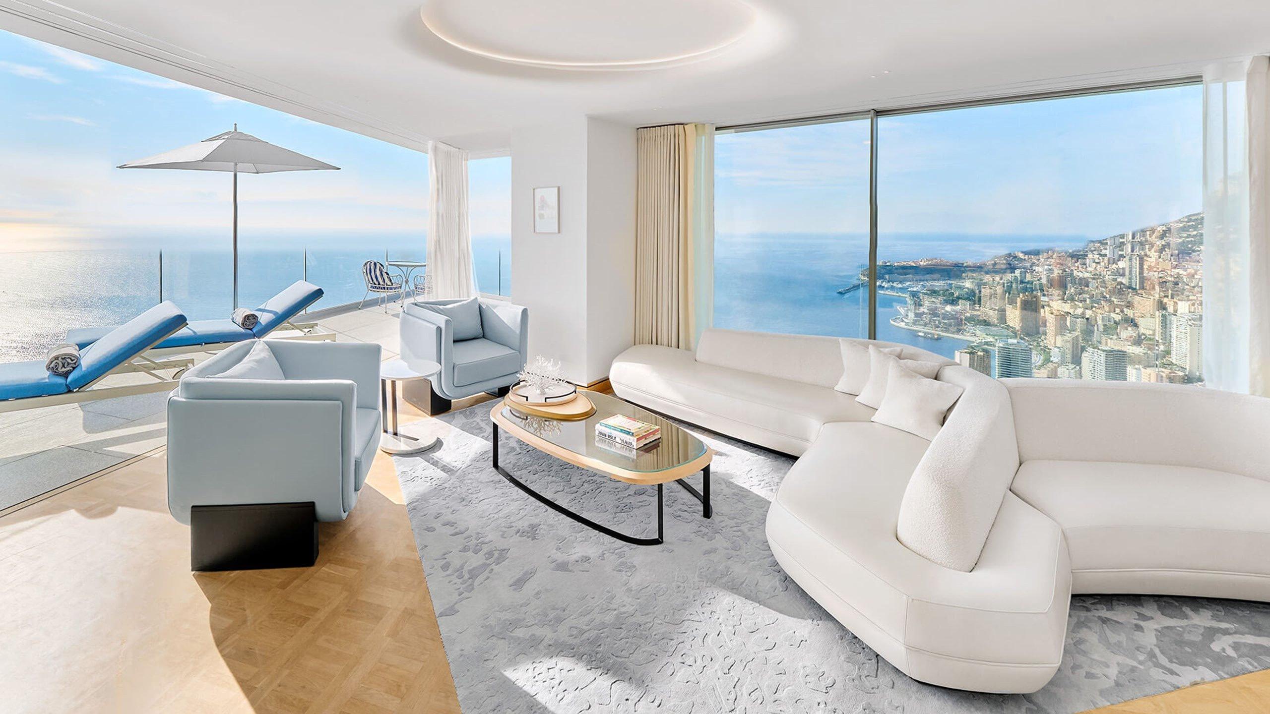 Maybourne Riviera: lounge area with curved sofa and ocean vistas