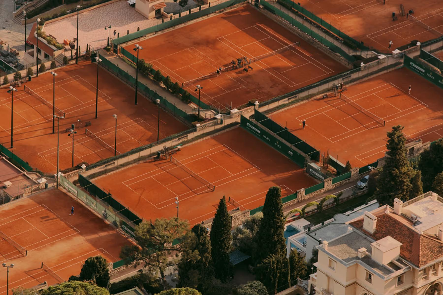 Maybourne Riviera: clay tennis courts on hillside overlooking coast