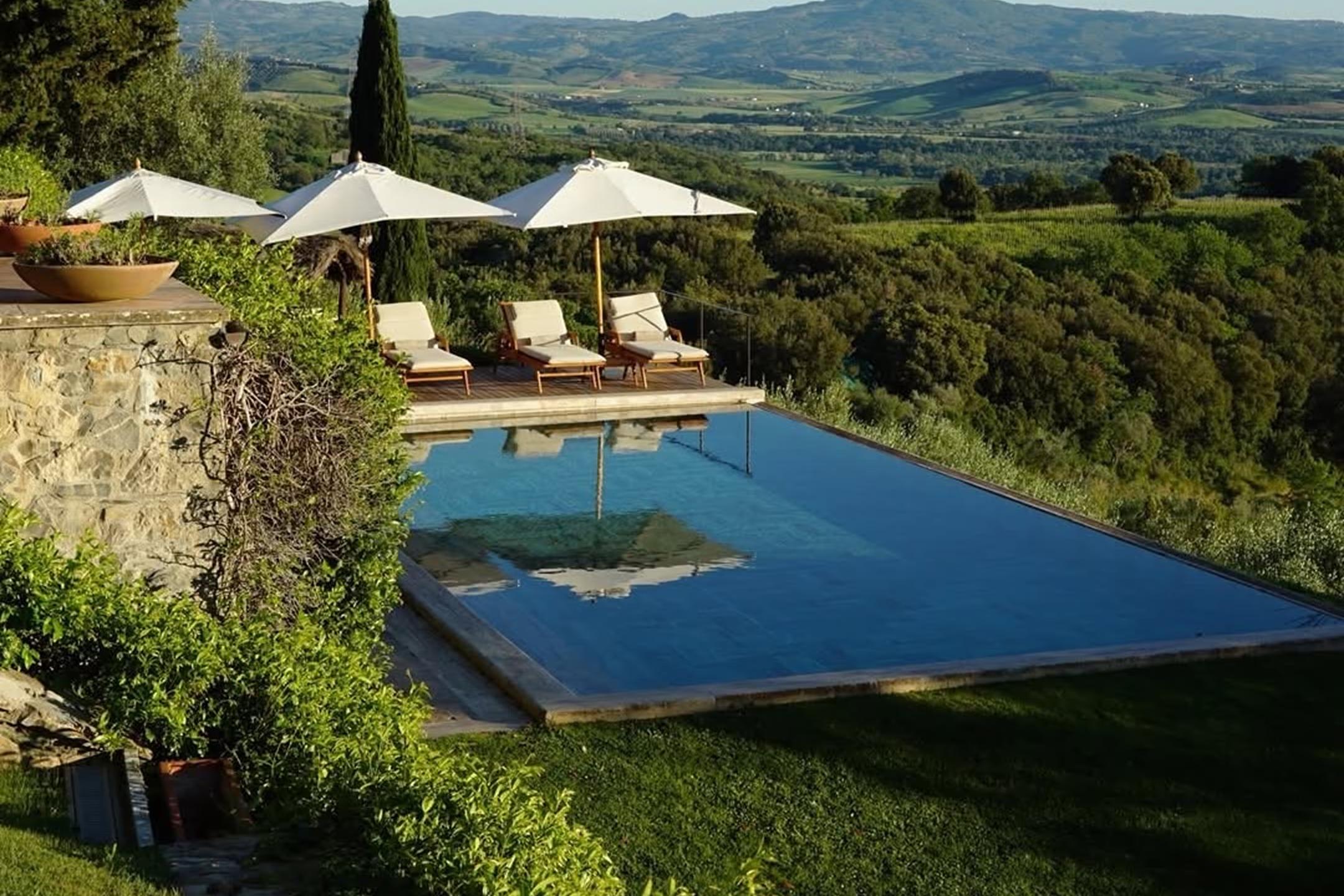 The pool cut into the hillside below the castle at Castello di Vicarello