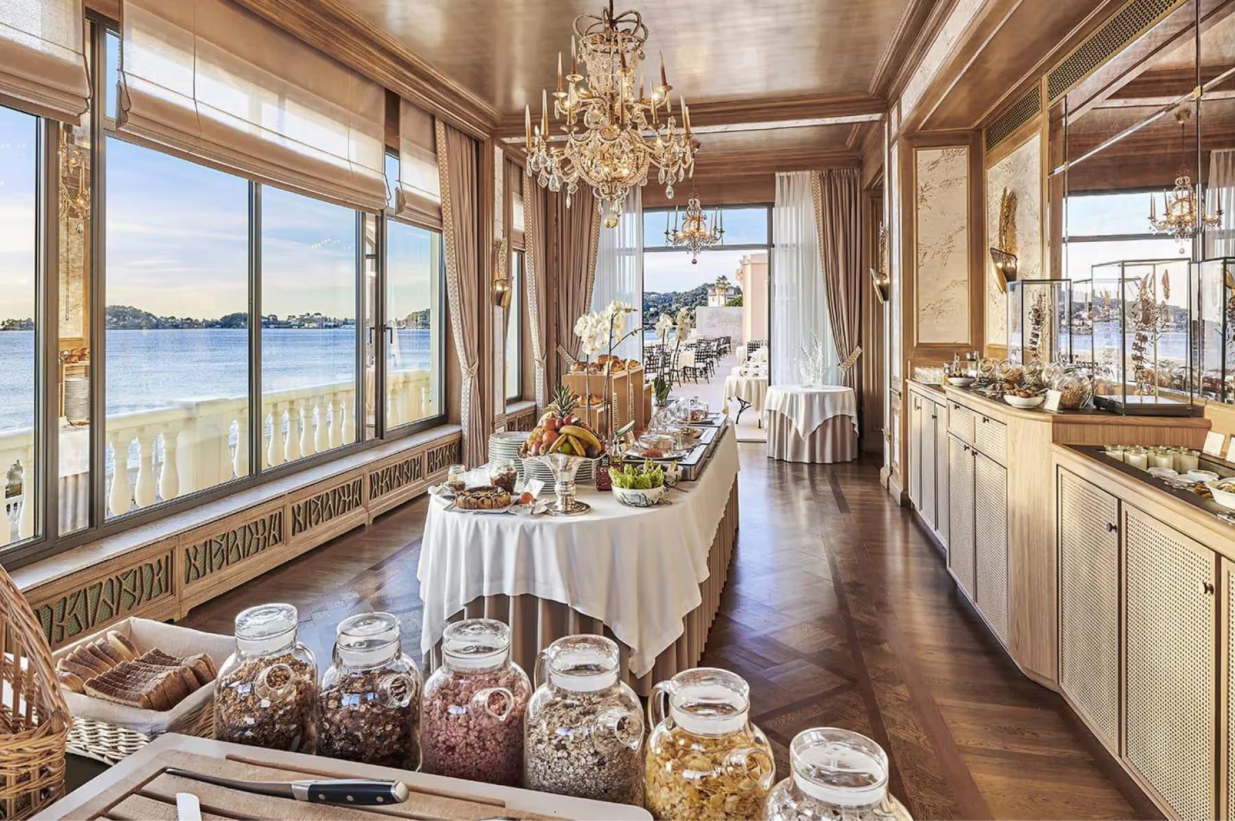 La Réserve de Beaulieu: fine dining room with picture windows overlooking the water and coastline