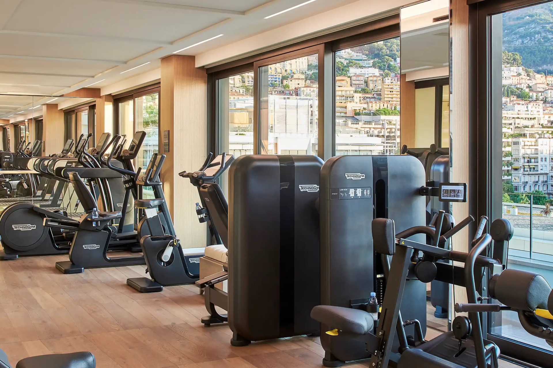 Hôtel de Paris Monte-Carlo: fitness center with exercise equipment and floor-to-ceiling windows