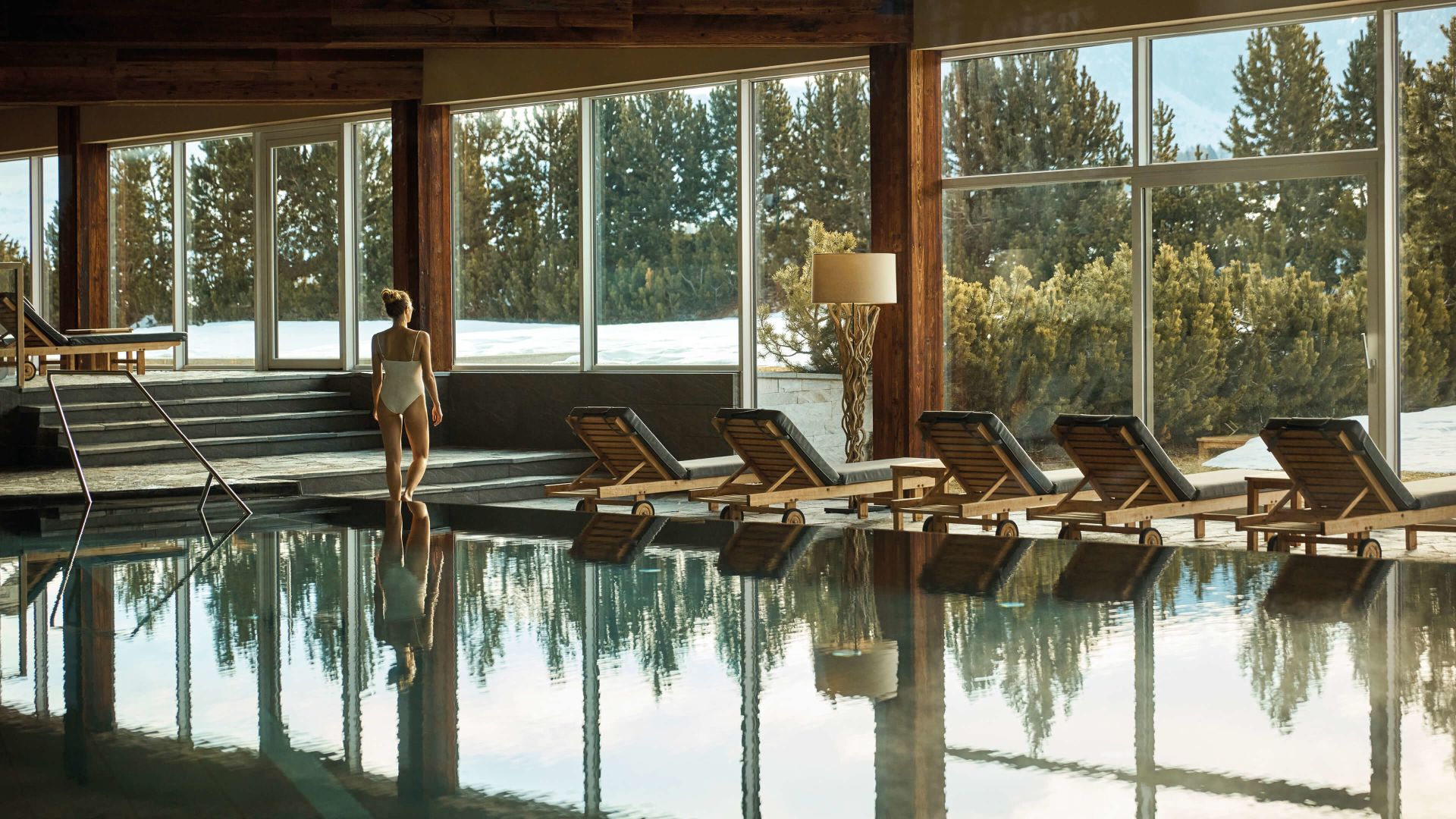 Loungers reflected in the indoor pool at COMO Alpina Dolomites