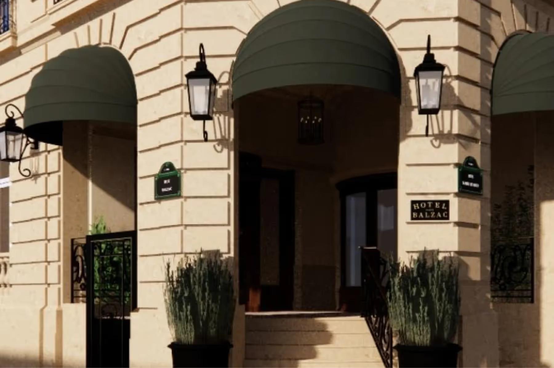Hôtel Balzac: the building’s arched entrance on the street with ivy and lanterns