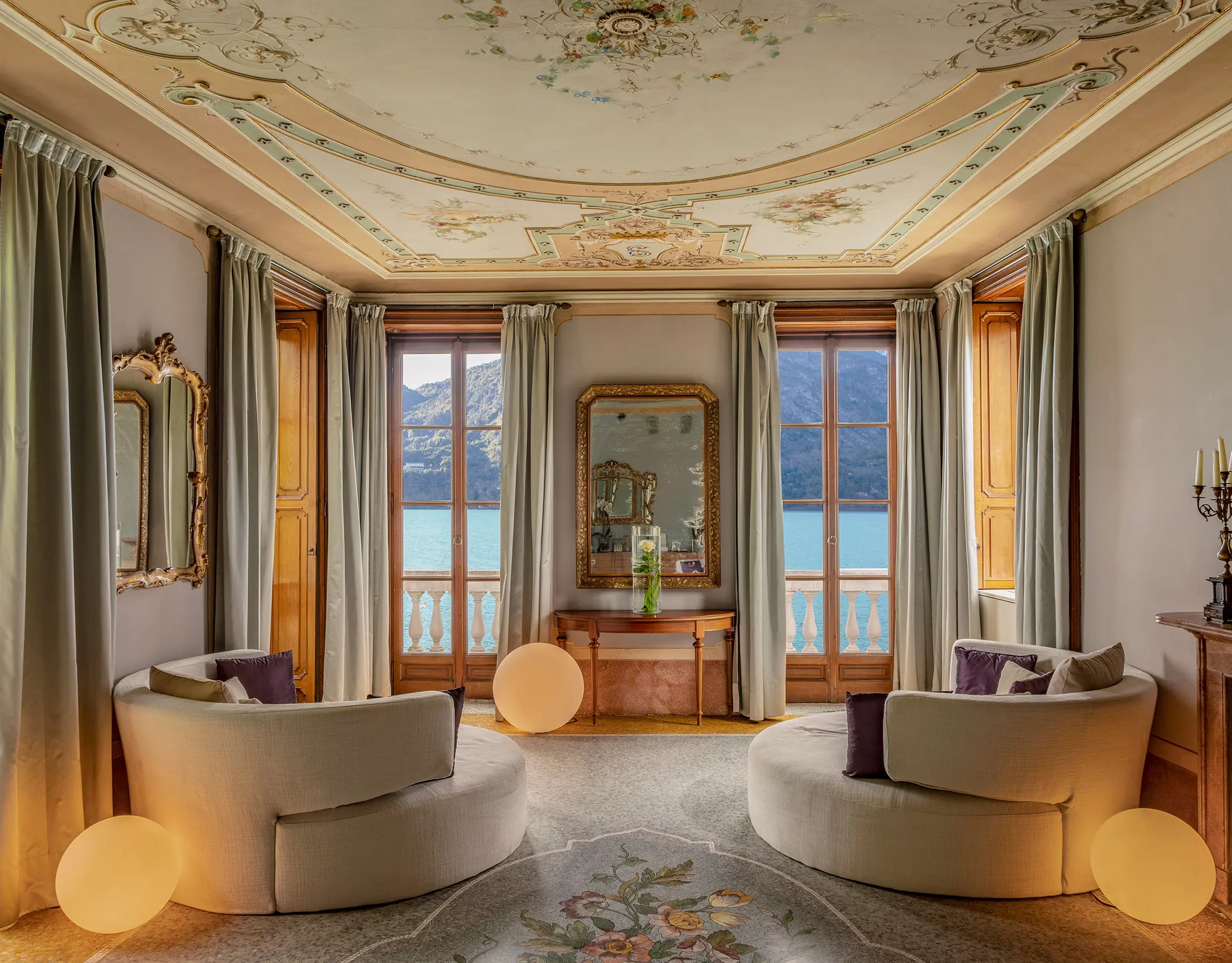 Grand Hotel Tremezzo: spa lounge with arched doorways, draped fabrics, and lake views